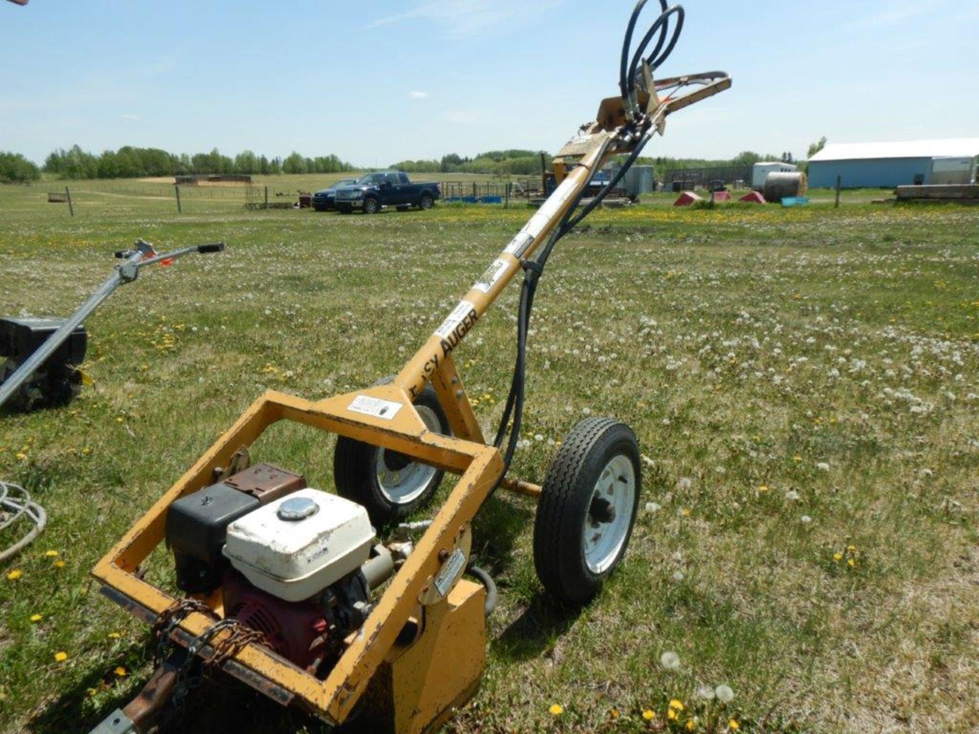 EASY AUGER PULL TYPE POST HOLE AUGER W/ HONDA 9HP ENGINE.