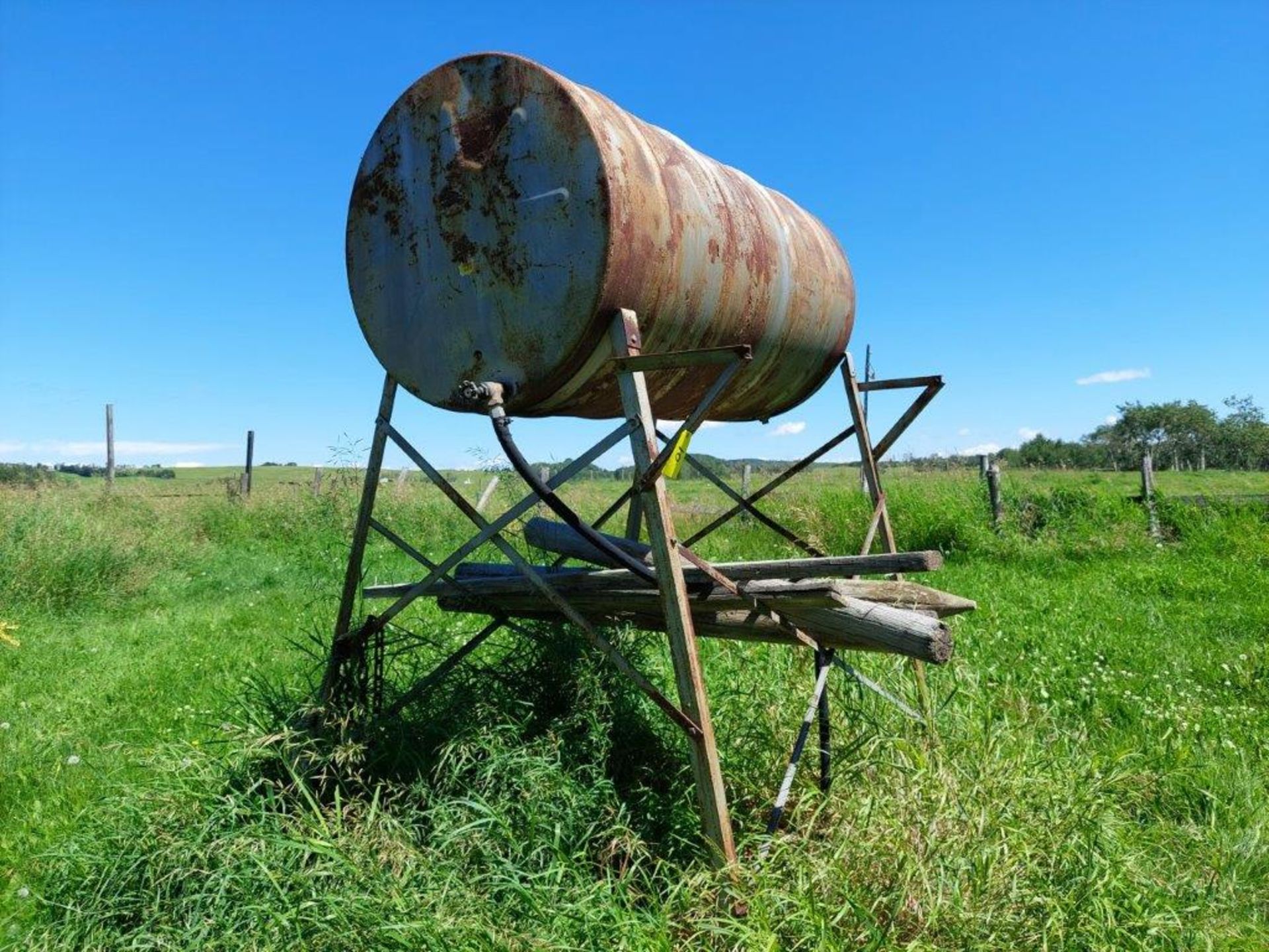 300 GAL. BULK FUEL TANK W/ QUANTITY OF DIESEL STILL IN TANK