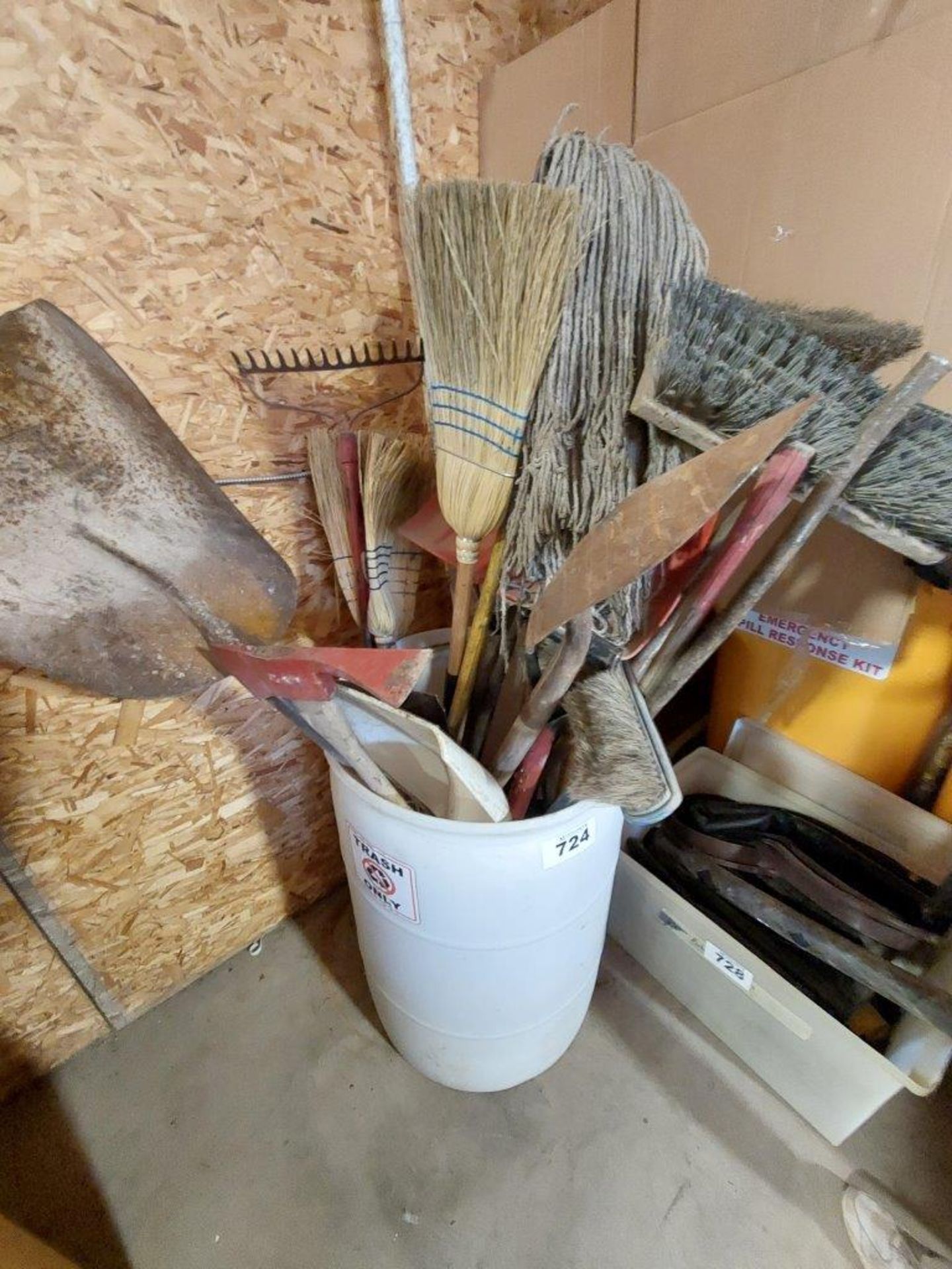 BARREL OF ASSORTED SQUEEGIES, SHOVELS, RAKES, MOPS, ETC.