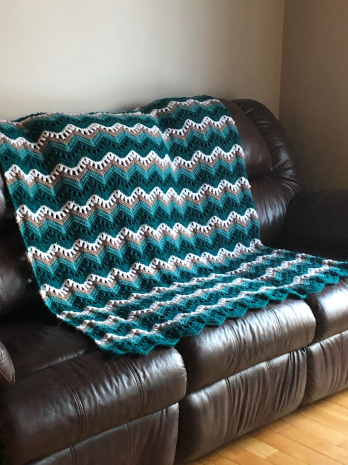 Handmade Crochet Throw w/ large Yeti Mug, Teal/Tan/White 56"×52" Retail Value: $125 - Donated By: - Image 2 of 2