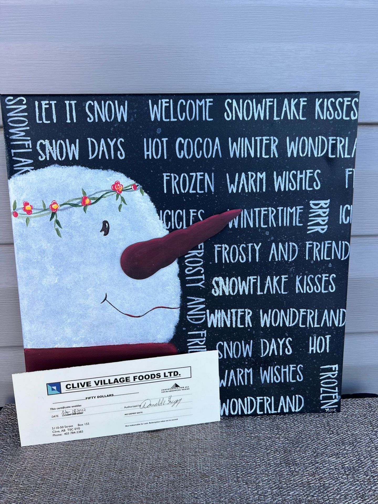 Snowman sign & $50.00 gift certificate - Donated By: Denick Enterprises LTD. - Retail Value: 90