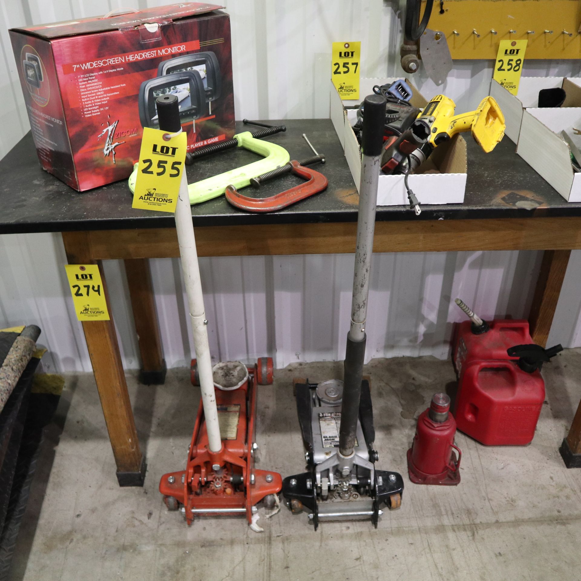 GARAGE LOT TO INCLUDE: C CLAMPS, (2) 3 TON FLOOR JACKS, (1) BOTTLE JACK, (2) GAS JUGS, (1 BOX) 7"