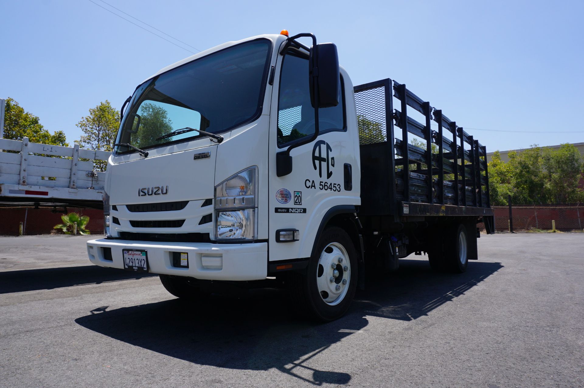 LOW MILEAGE! 2020 ISUZU NQR STAKE BED, MAXON TUK-A-WAY LIFT GATE, WEIGHT CLASS B, 5.2L TURBO DIESEL,