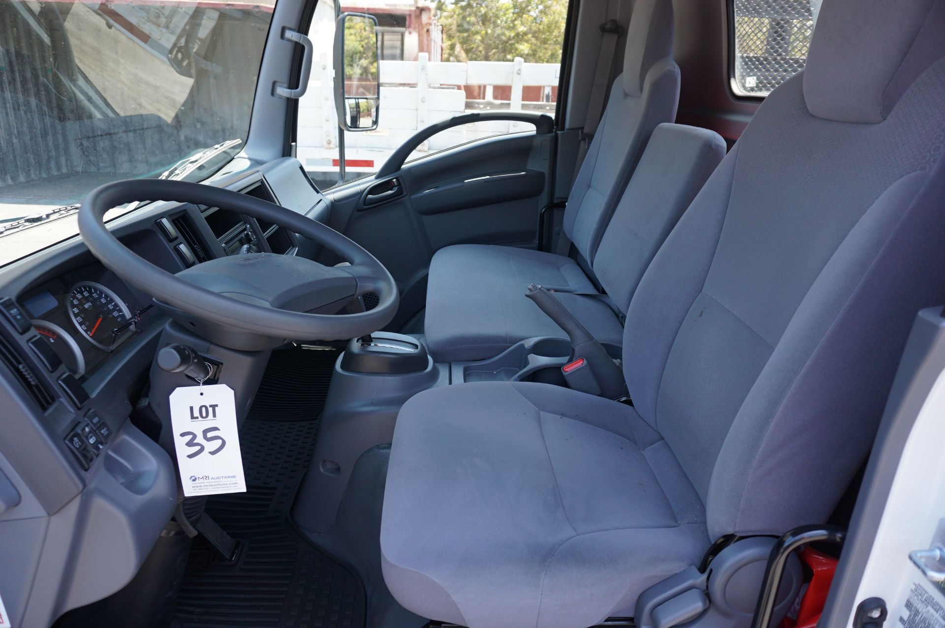 LOW MILEAGE! 2020 ISUZU NQR STAKE BED, MAXON TUK-A-WAY LIFT GATE, WEIGHT CLASS B, 5.2L TURBO DIESEL, - Image 9 of 12