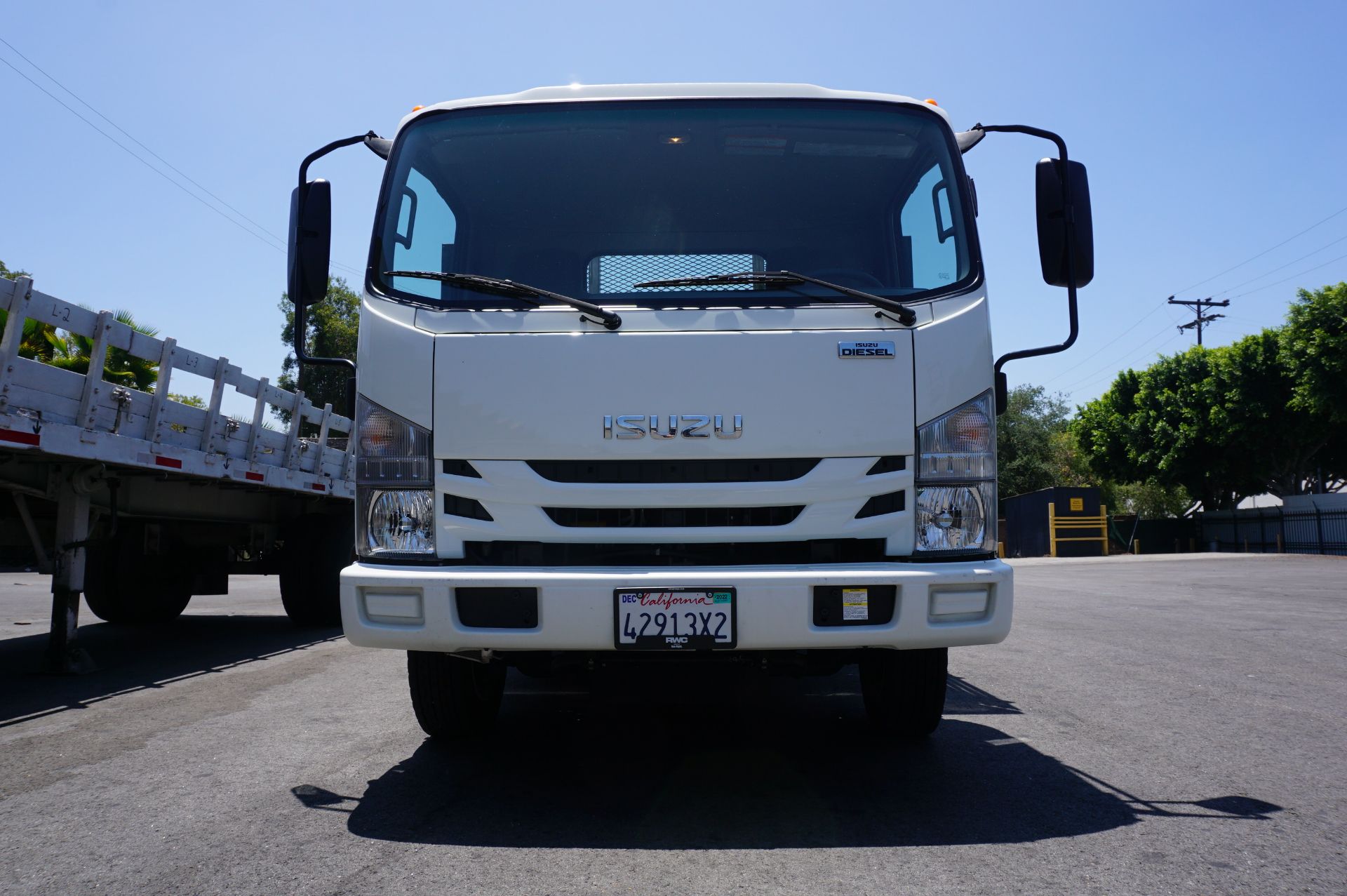 LOW MILEAGE! 2020 ISUZU NQR STAKE BED, MAXON TUK-A-WAY LIFT GATE, WEIGHT CLASS B, 5.2L TURBO DIESEL, - Image 2 of 12