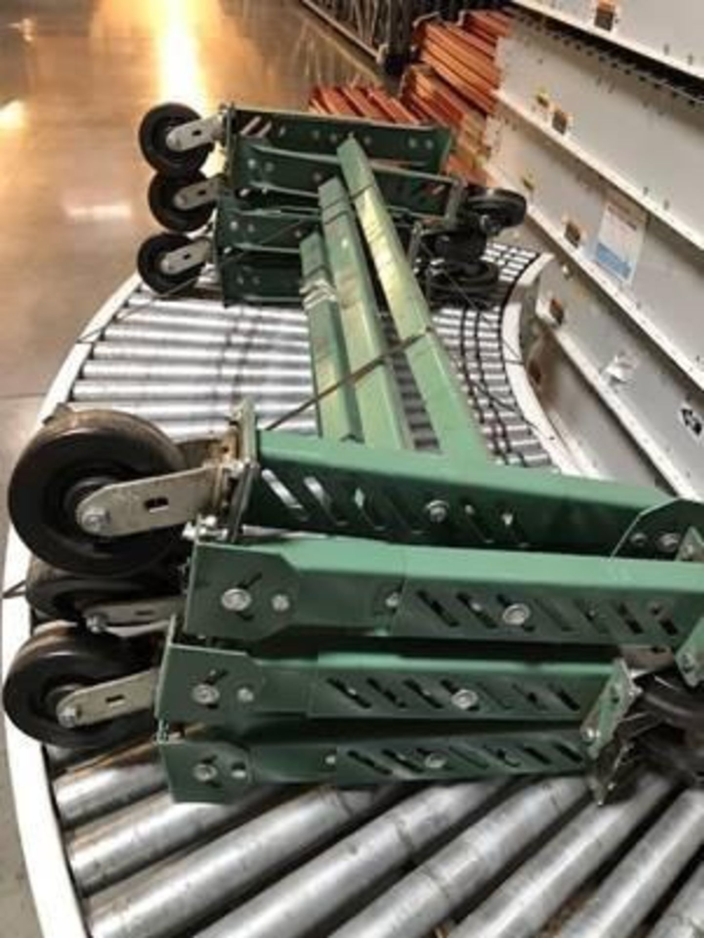 USED 51" L X 4'' W, 18" H H-LEG FOR ROACH CONVEYORS, W/ CASTERS, COLOR: GREEN, LOCATION: 13770 W. PE