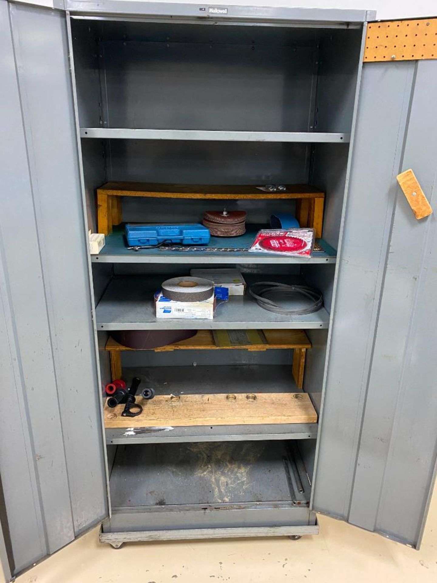 2-DOOR CABINET ON ROLLING BASE W/ DRILL BIT INDEX, SAW BLADES, SANDPAPER