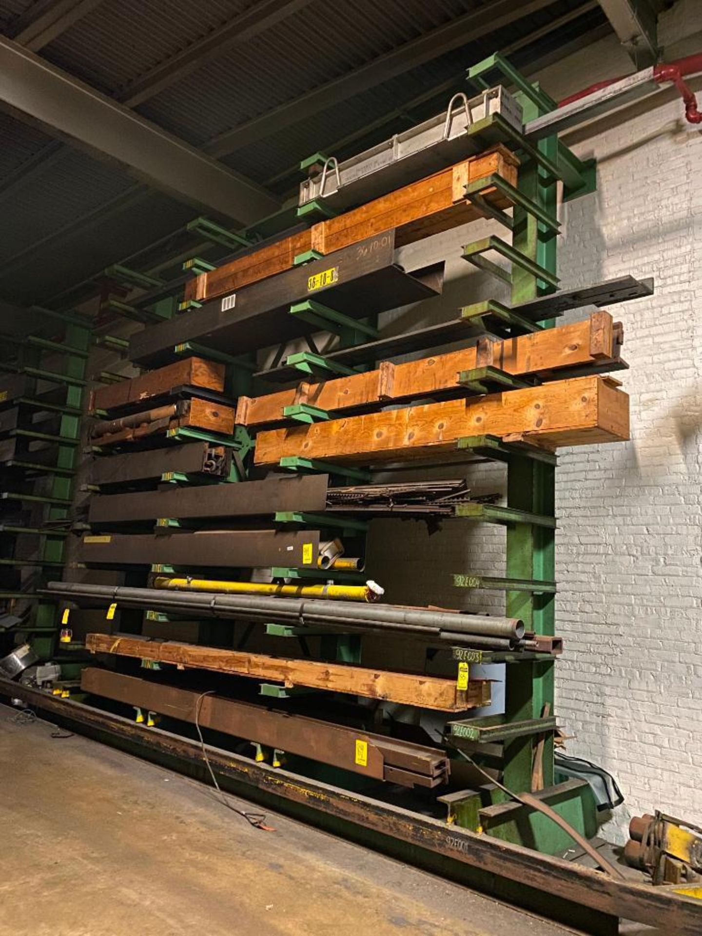 CANTILEVER RACK CONTENT: SHEAR BLADES IN STEEL CONTAINER, I-BEAMS, (10) 20' LONG STEEL TUBING, CRANE