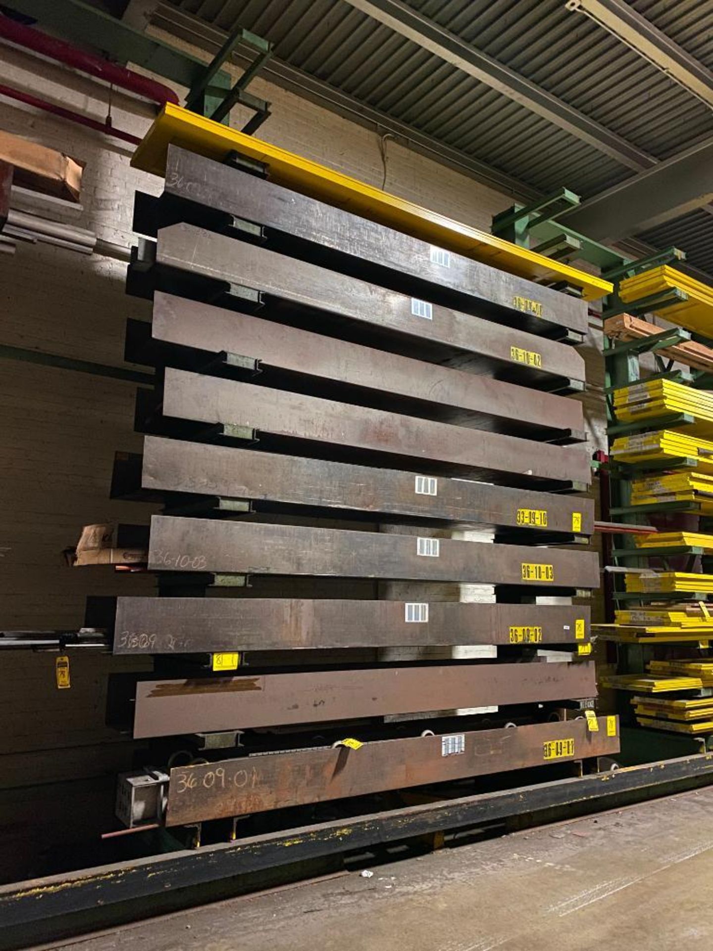 CANTILEVER RACK CONTENT: (5) SETS OF 2' SHEAR BLADES IN STEEL CONTAINERS, CRANE CONDUCTOR BARS