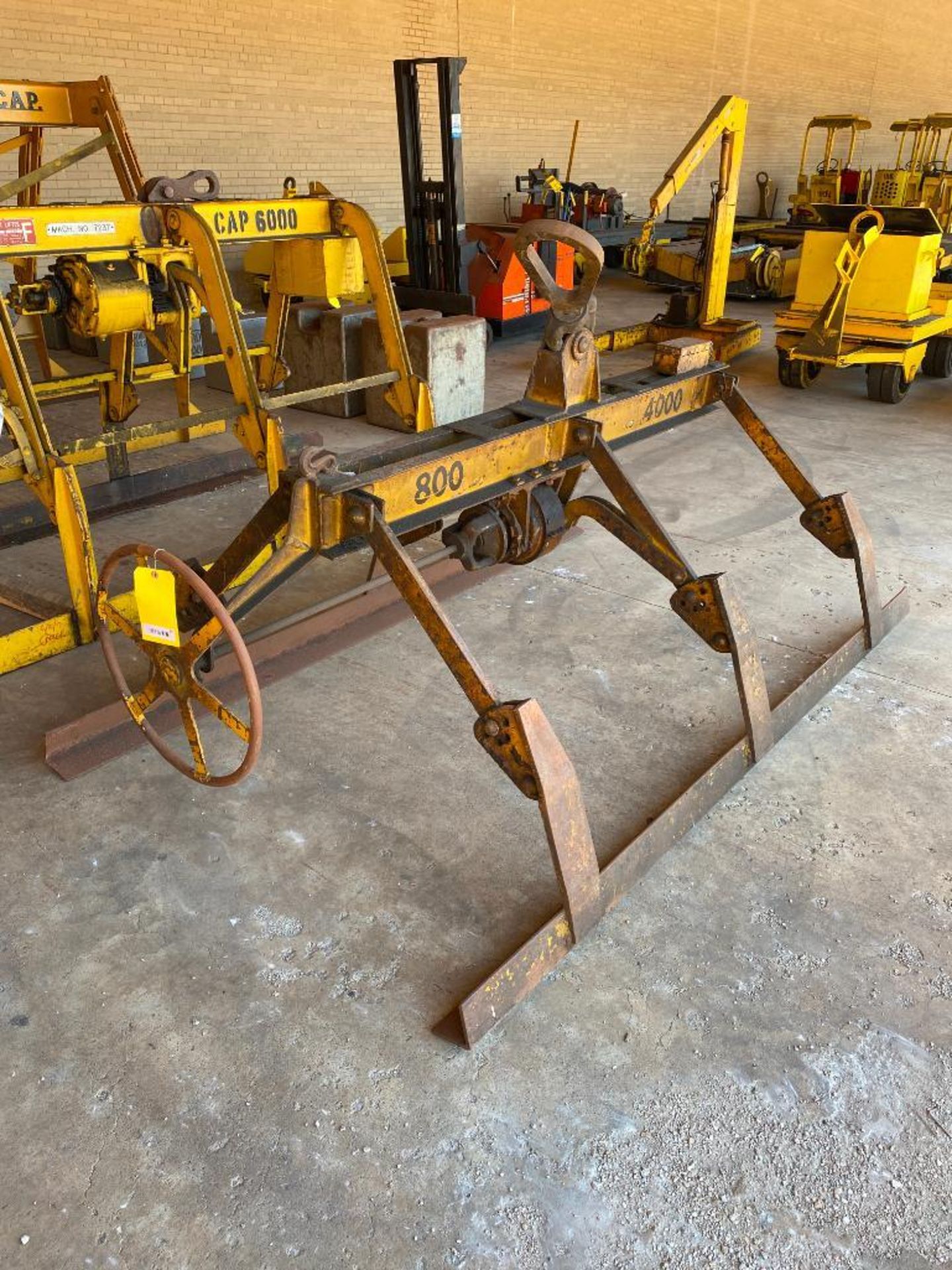 2-TON MECHANICAL SHEET LIFTER, 8' LIFT ARMS