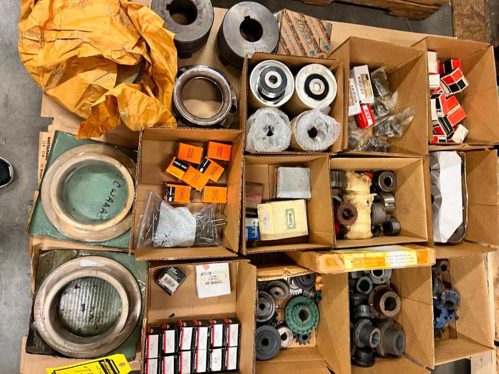 SKID OF (NEW & USED) BUSHINGS, COUPLINGS, PULLEYS, SPROCKETS, BRANDS SUCH AS: THK, LOVEJOY, MARTIN,