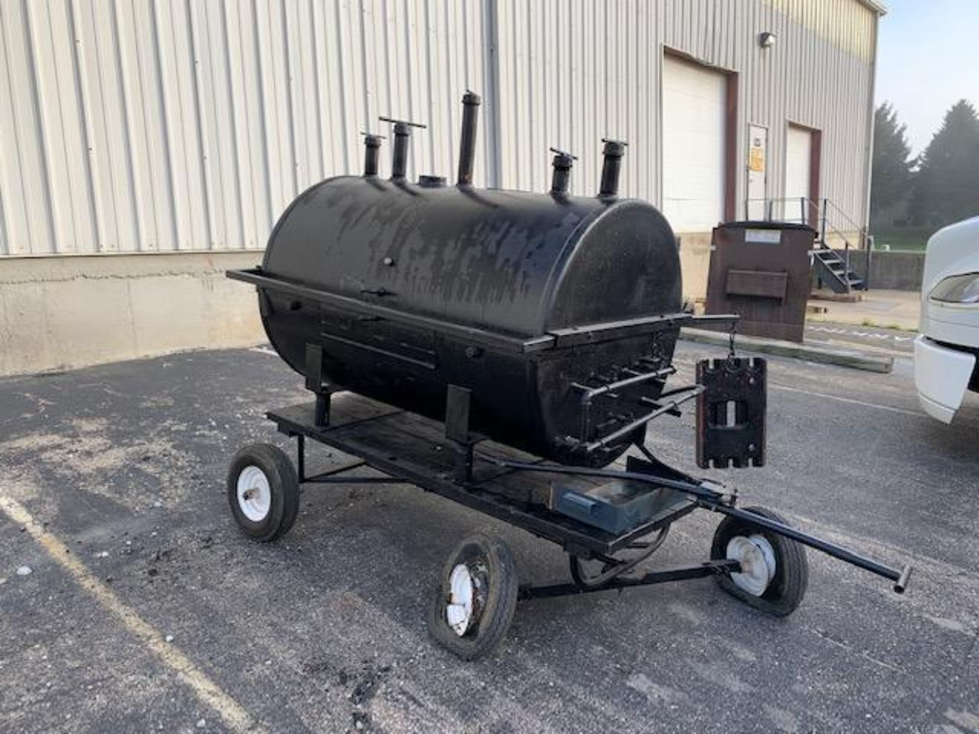 Custom made mobile BBQ grill, uses propane gas (has two flat tires)