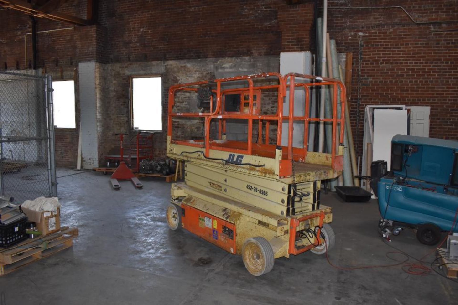 JLG Scissor Lift, Model 3246, Solid Tires, 24-Volt Electric, On-Board Charger, 849 Hours, 32" Deck,