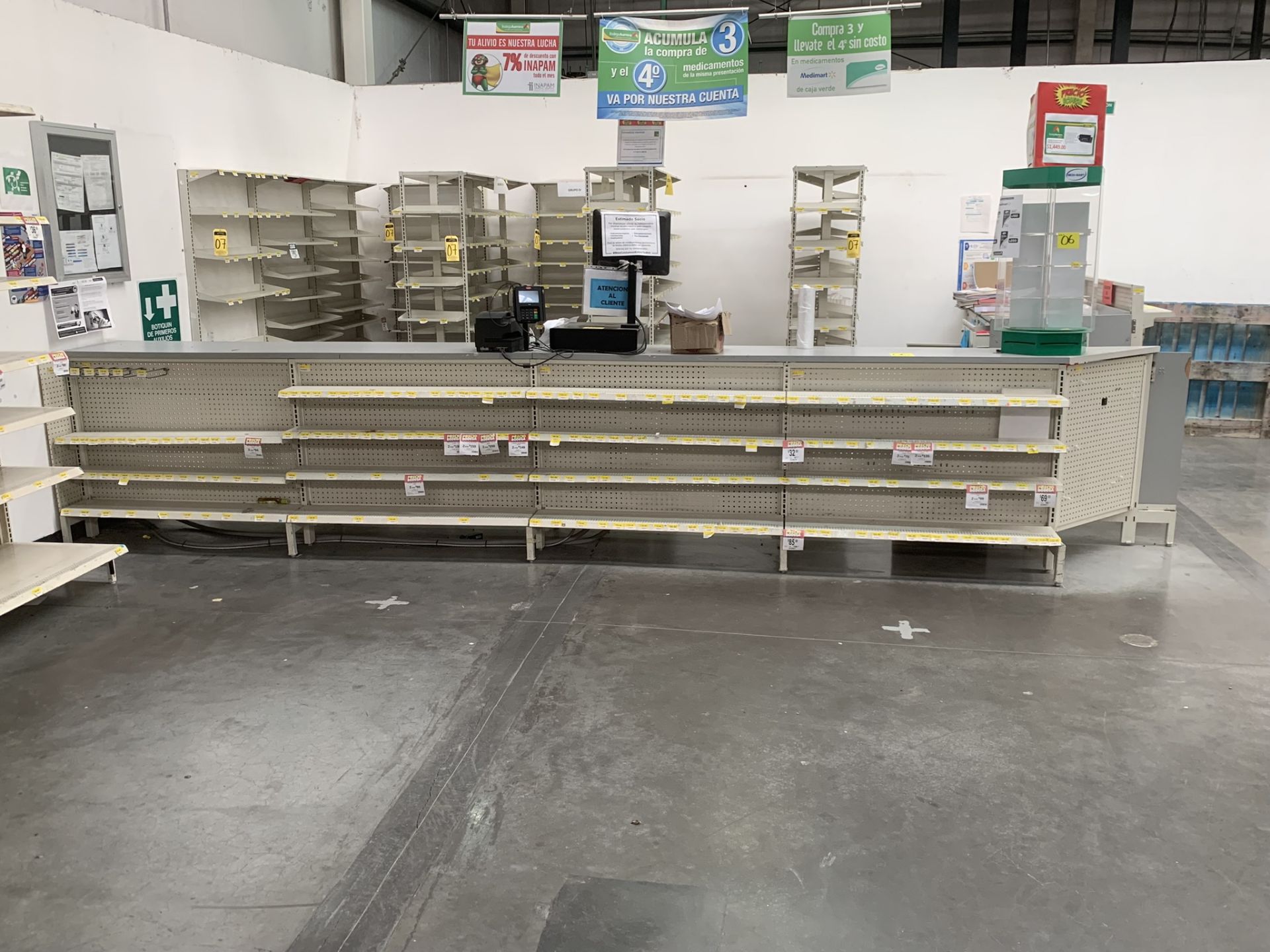 L-shaped counter for a pharmacy with a display of 31 shelves