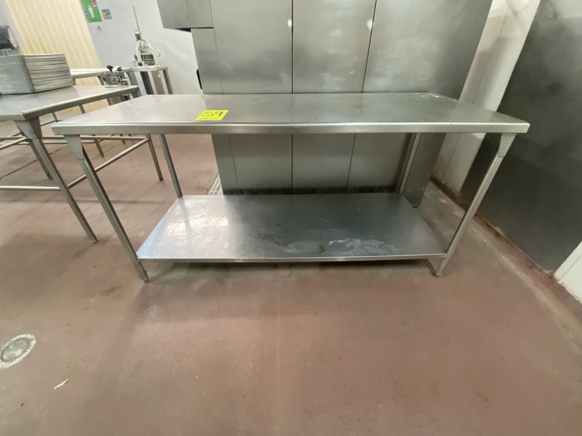 1 Stainless steel work table measures 1.80 x 0.75 x 0.90 mts