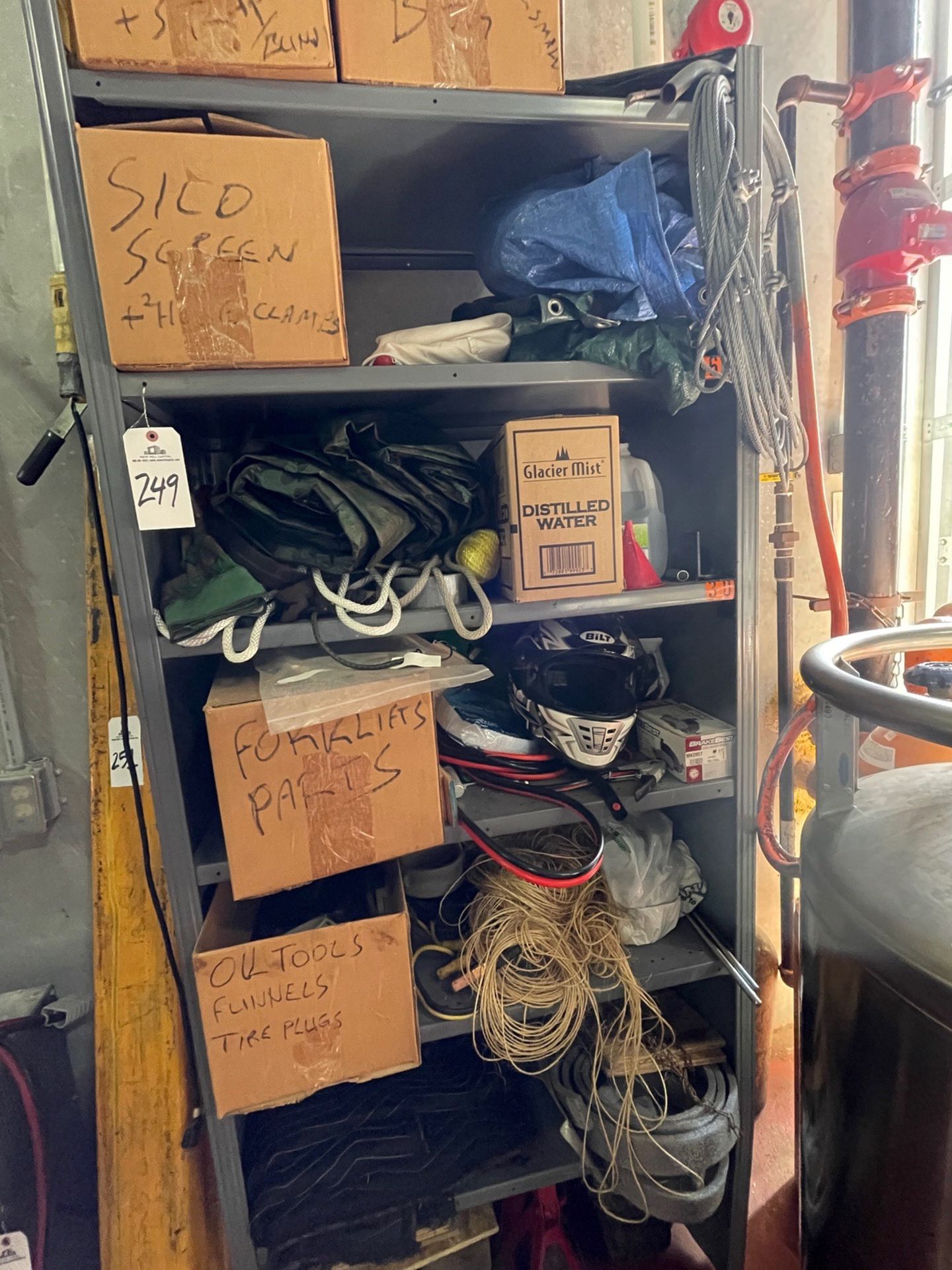 Section of Loading Dock Parts (includes items on shelf and shelving unit), shelving | Rig Fee $200