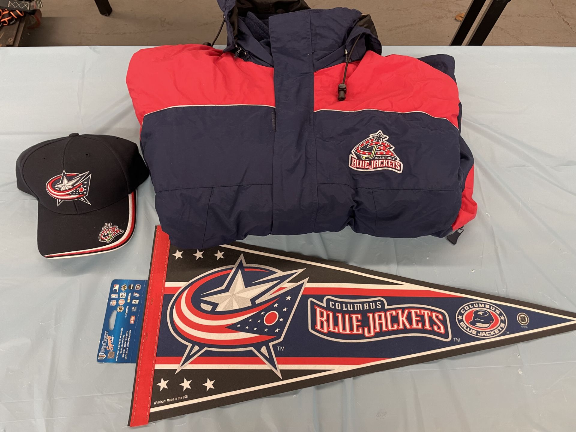 (Lot) Columbus Blue Jackets c/o: Pennant w/ new and original logo, Snap back hat, 4 in 1 Blue