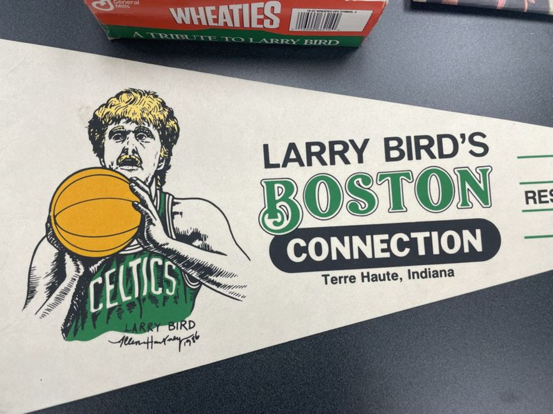 (Lot) Larry Bird c/o: Wheaties Box tape on box , Boston Connection Pennant, International Herald - Image 2 of 7