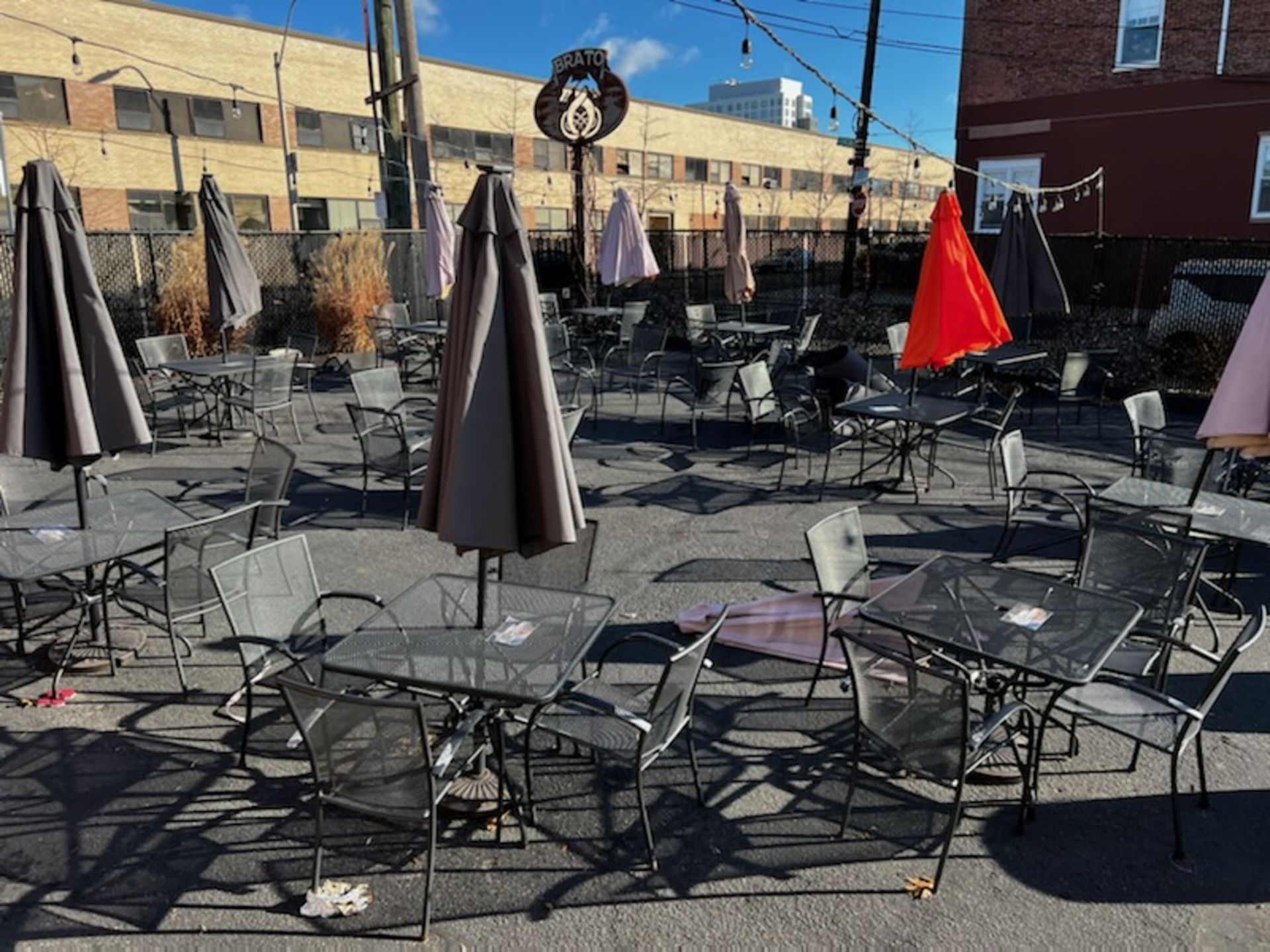 (7) 36" x 36" Wire Mesh Patio Tables w/(28) Matching Chairs, (7) Umbrellas & (7) Bases