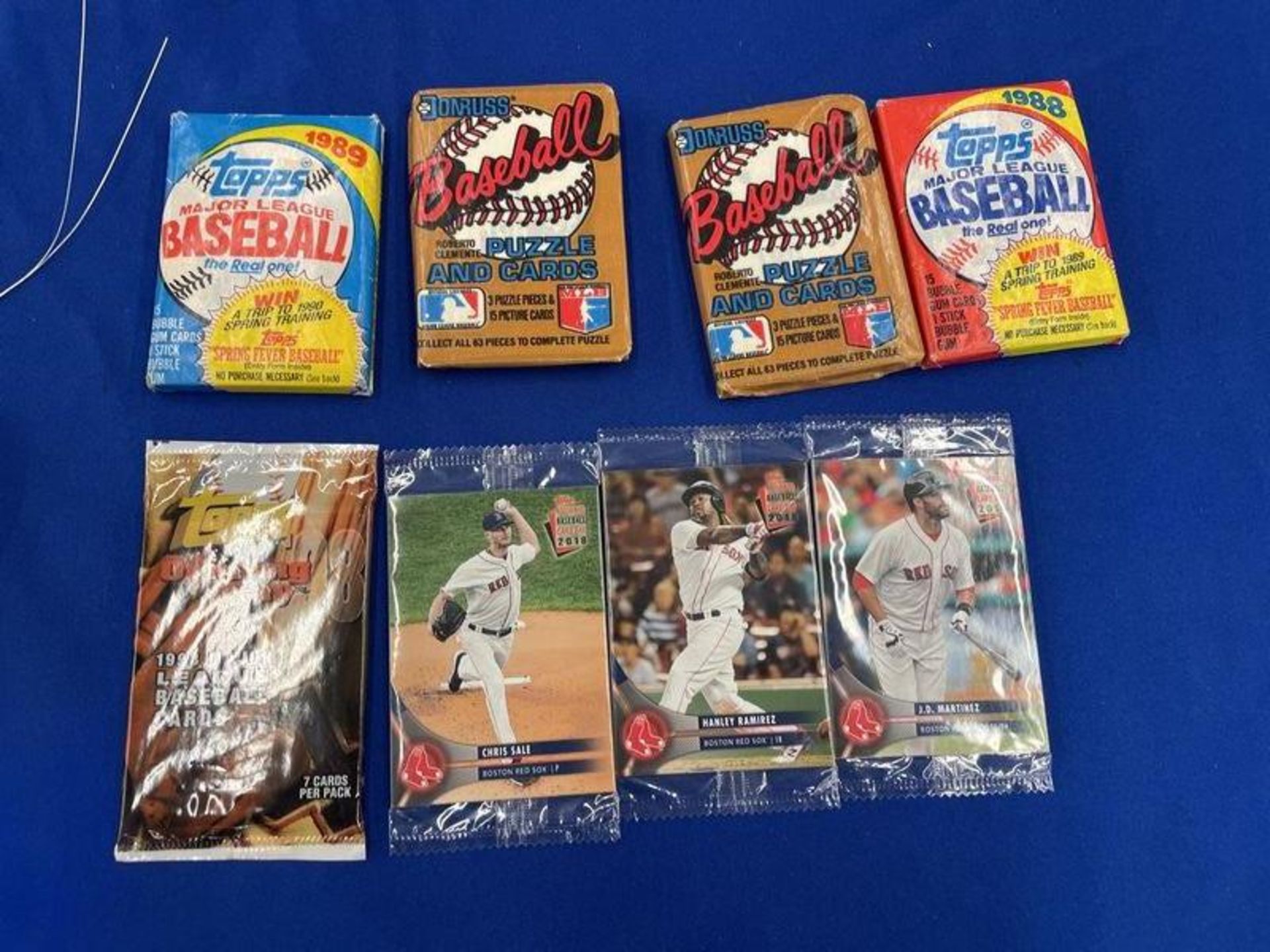 (8) Unopened Topps 1988,1989, 1998, (3) Topps 2018,and (2) Donruss Roberto Clement Puzzle and Card