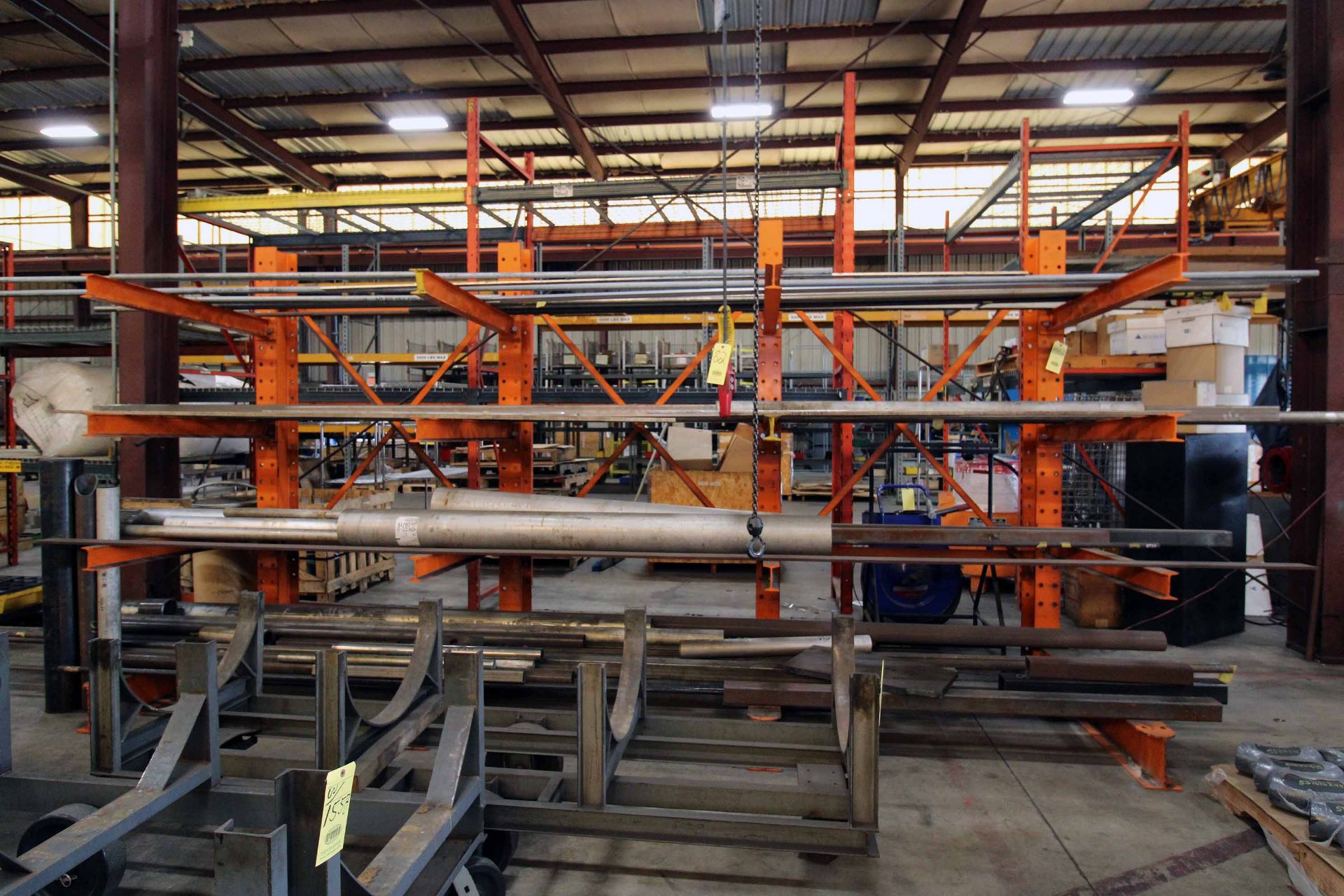 CANTILEVER RACK WITH CONTENTS: stainless flat bar, round & square tubing, rack: 15'L x 8'ht. w/ 4'