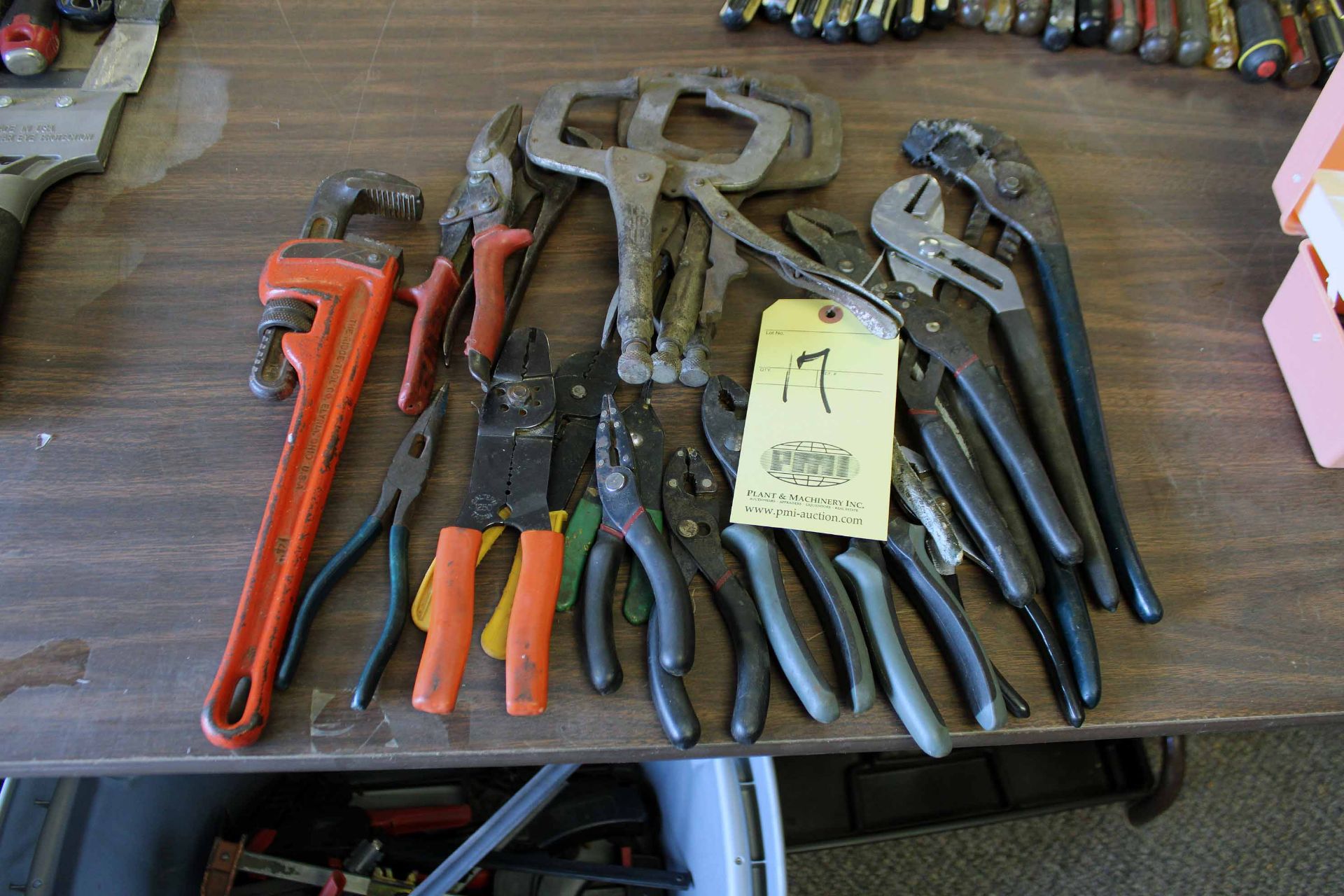 LOT CONSISTING OF: plyers, wire crimpers, pipe wrench, tin snips, channel locks & clamps (Located