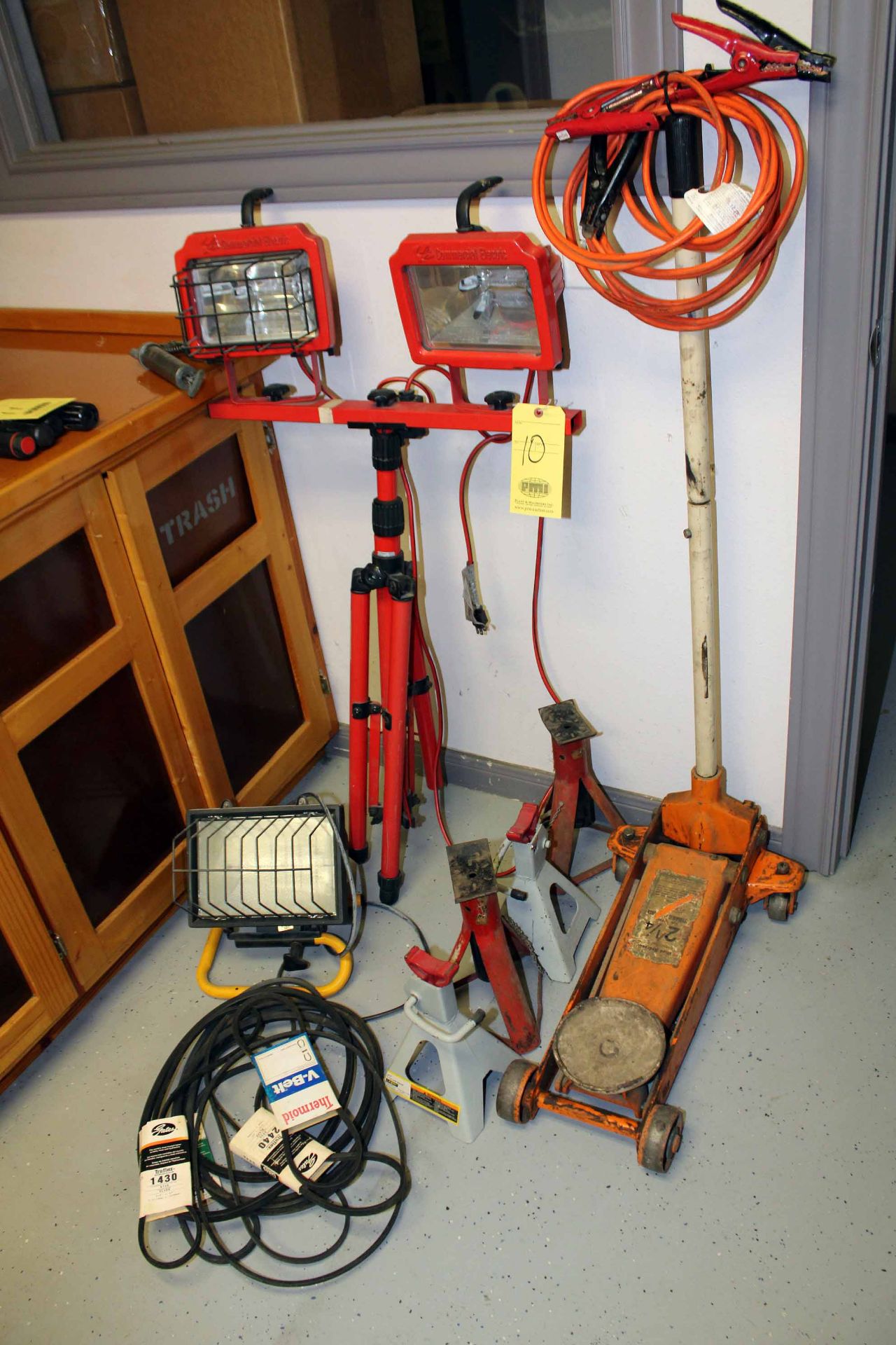 LOT CONSISTING OF: 2-1/4 T. cap. floor jack, (4) support jacks, (2) work lights, v-belts, jumper