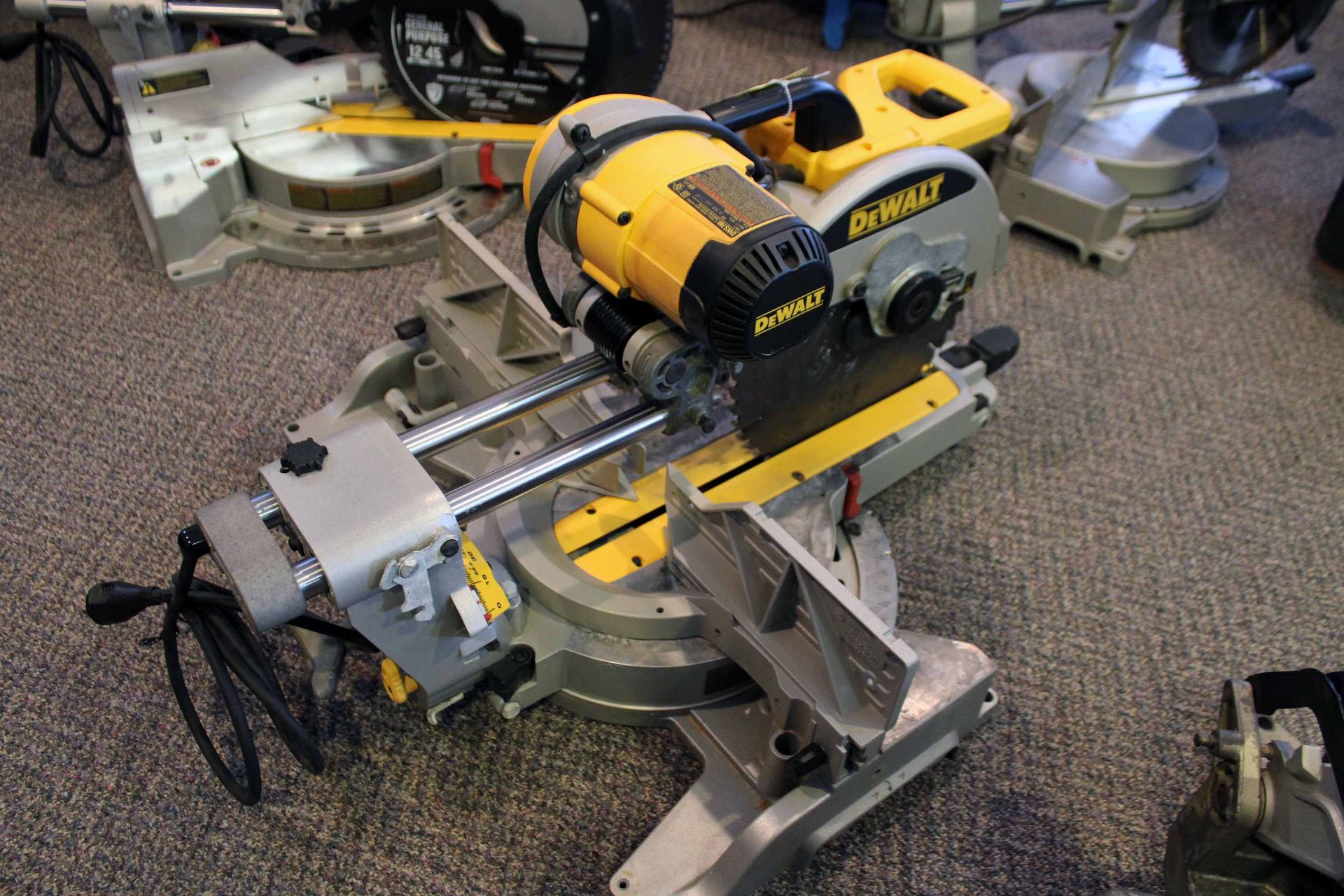 MITER SAW, DEWALT DWS 780. 12" double-bevel, compound saw, 15 amp. motor, 3,600 RPM (Located at: