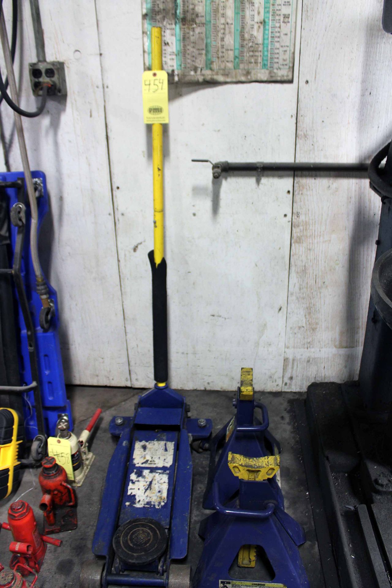 LOT CONSISTING OF: (1) 3-1/2 T. service jack & (2) 7 T. jack stands