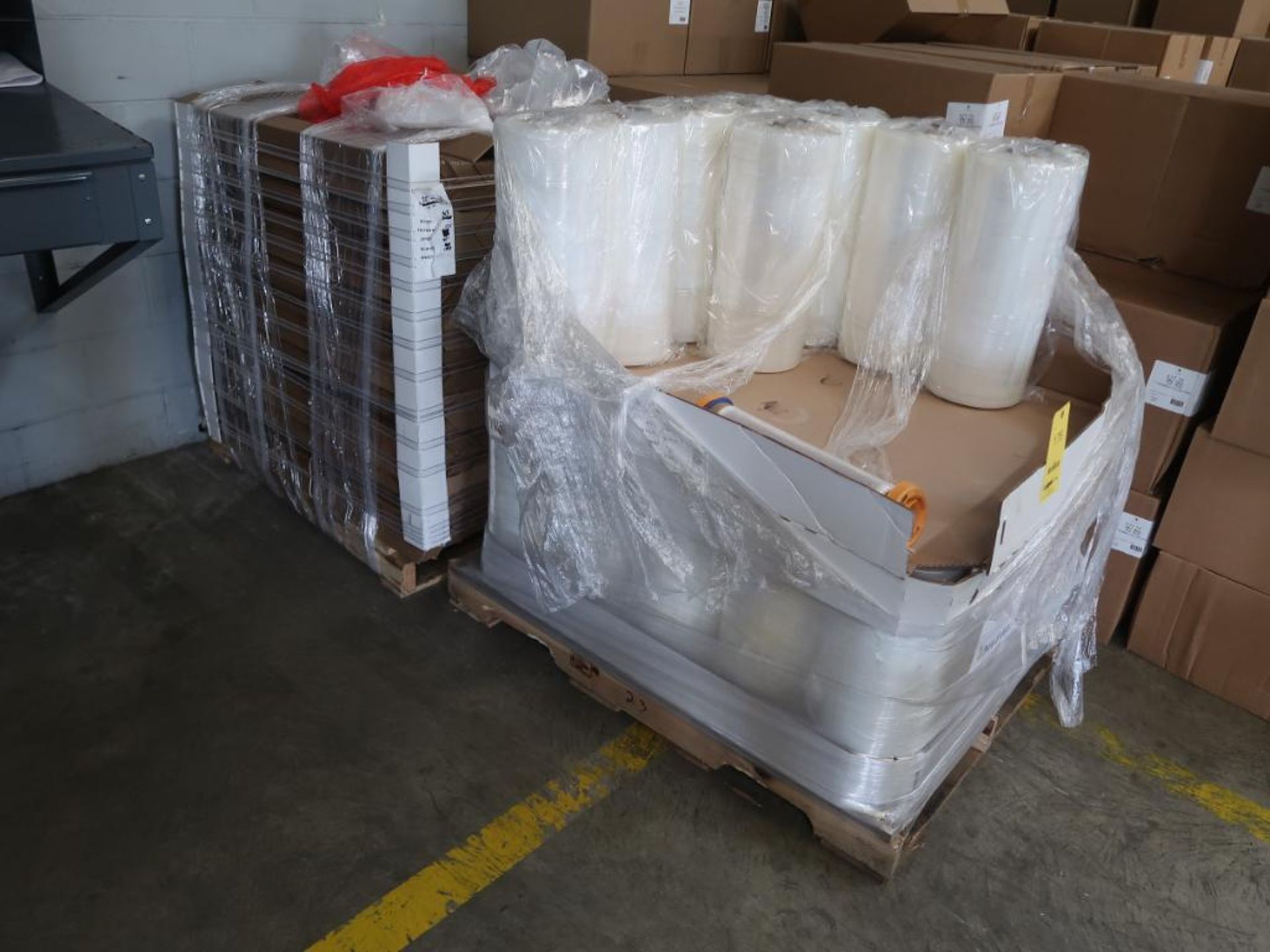 LOT: (24) Rolls of Shrink Wrap on Pallet, (1) Pallet Cardboard Corners (LOCATION: 39 PEARCE