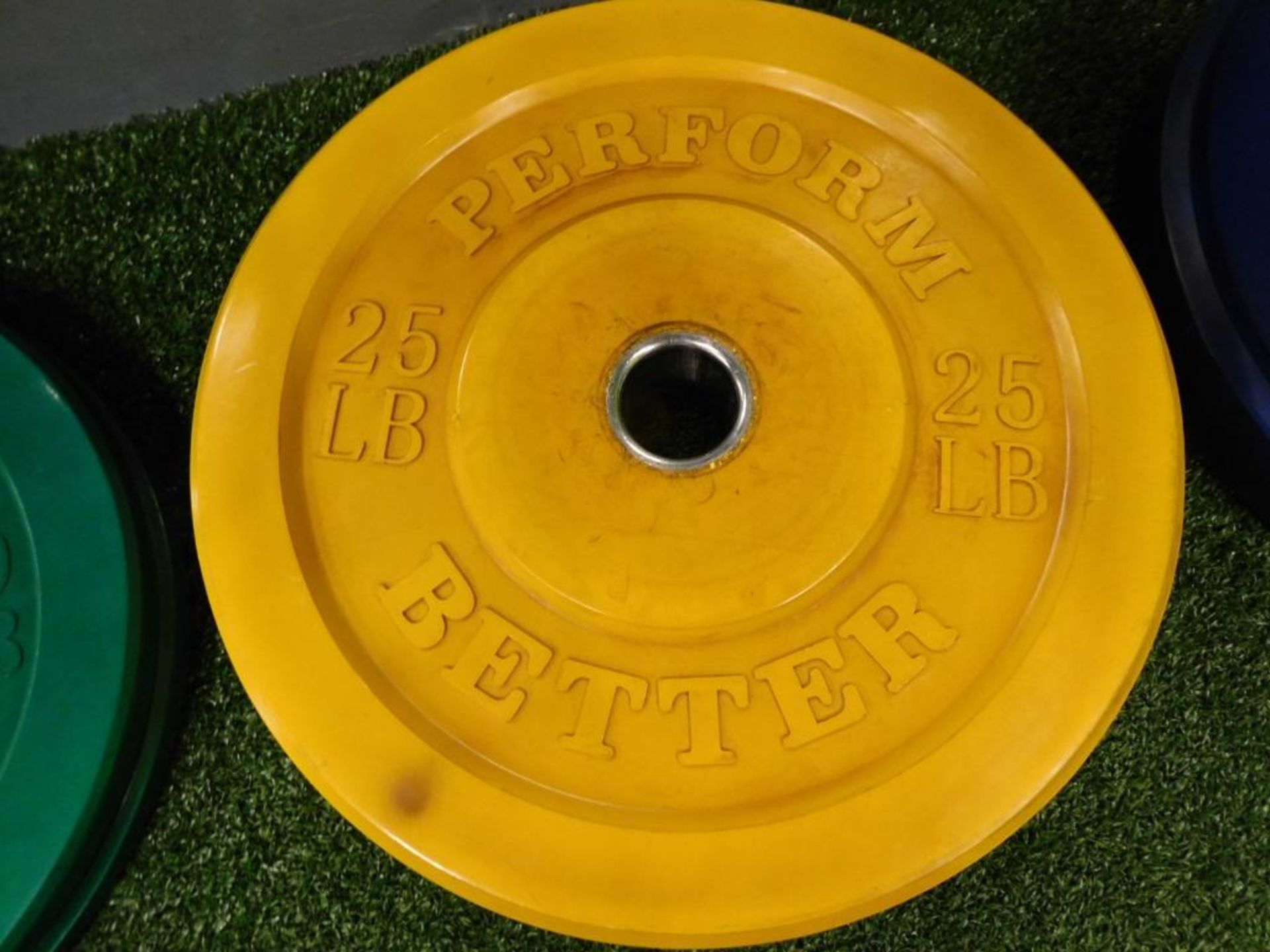 LOT: (2) Perform Better Rubber Coated 25 lb. Plates