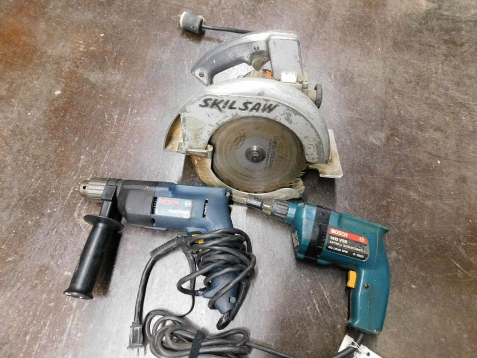 LOT: (1) Skil Saw 8-1/4" Circular Saw, (1) Bosch 1412 VSR Drywall Screw Driver, (1) Bosch 1023 VSR