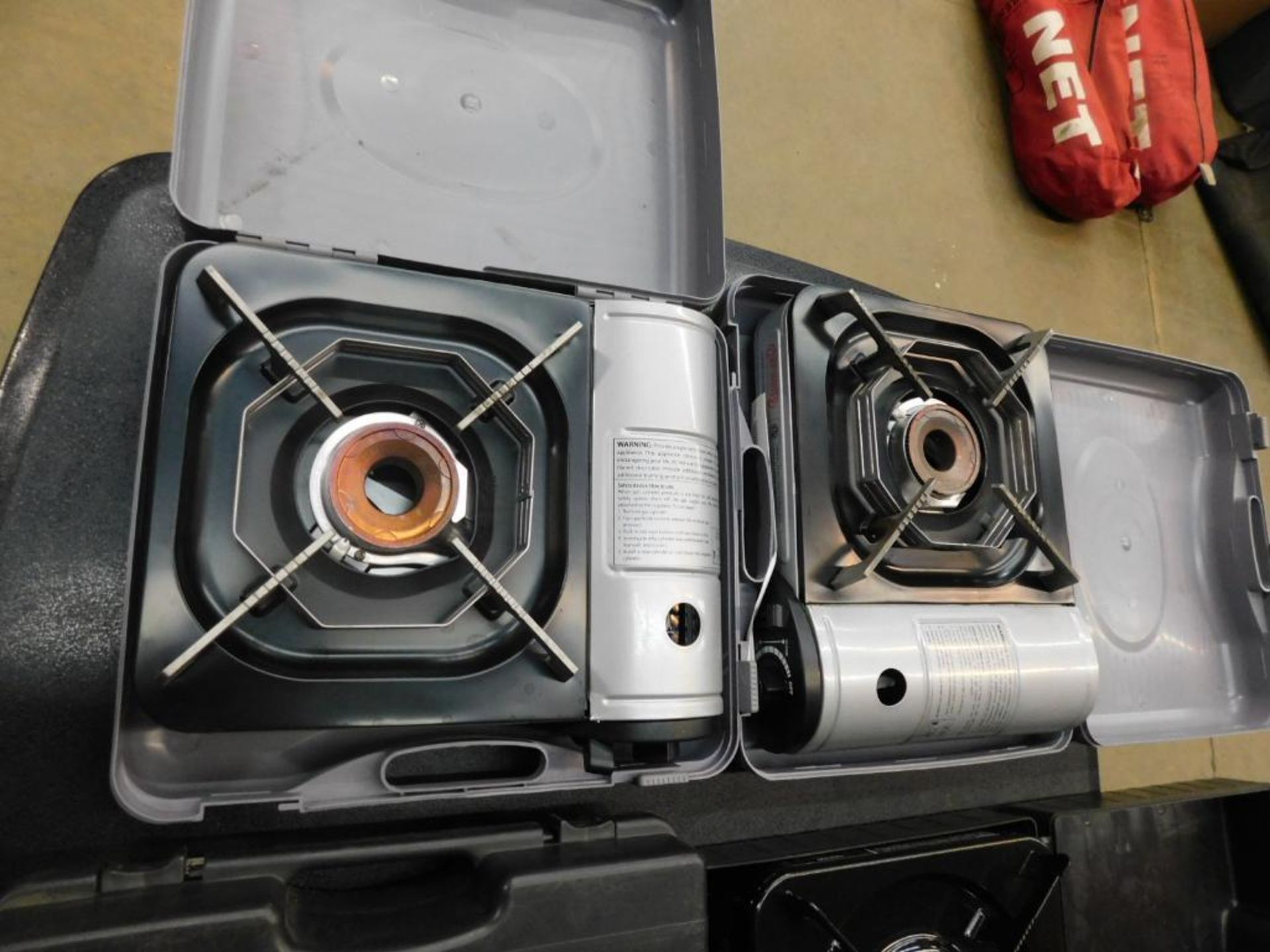 LOT: (2) Chef Master Portable Butane Stoves, (2) Butane Cans (LOCATION: 1766 Waukegan Rd., Glenview,