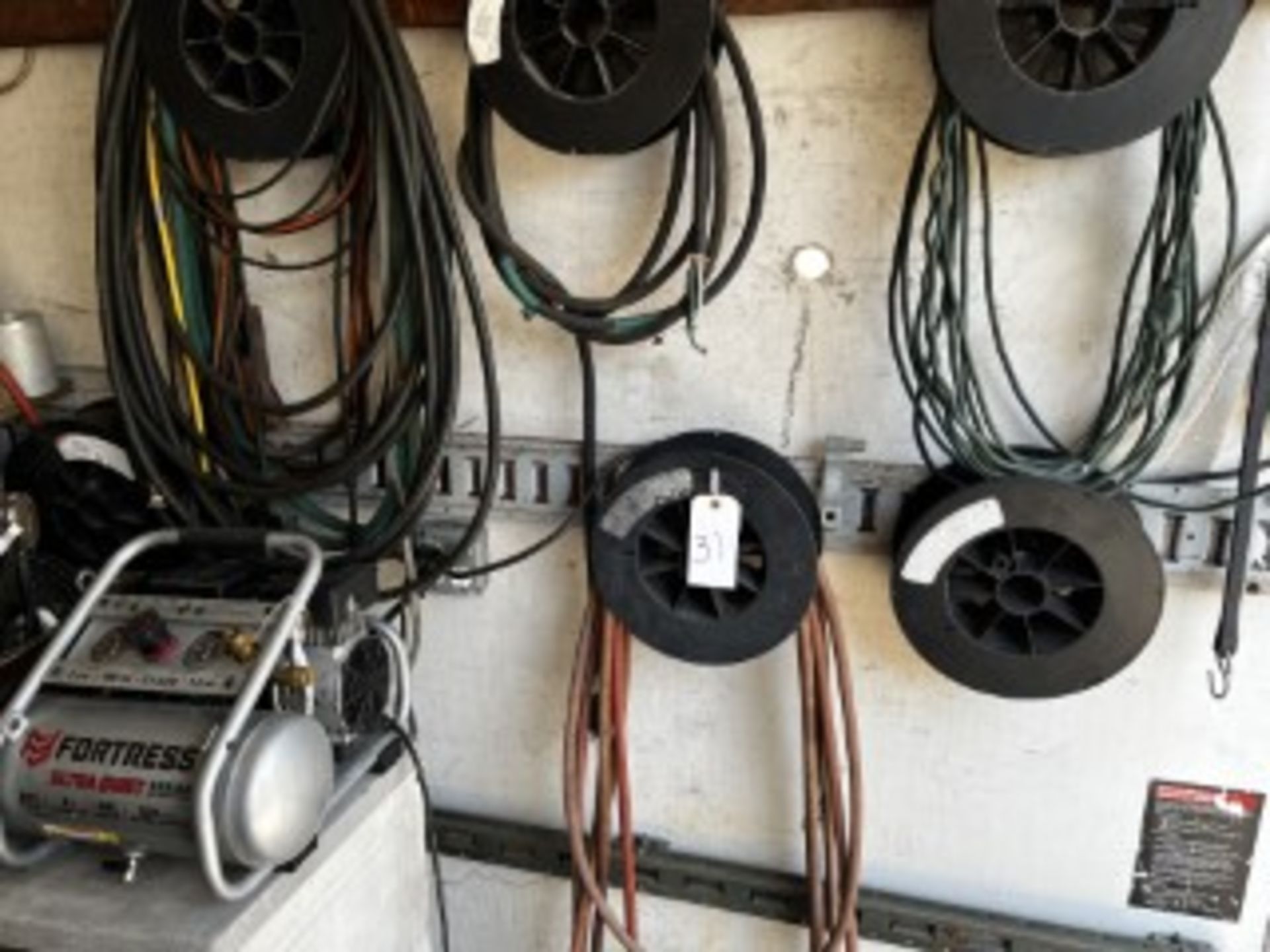 SPOOL OF AIR HOSE & EXTENSION CORDS