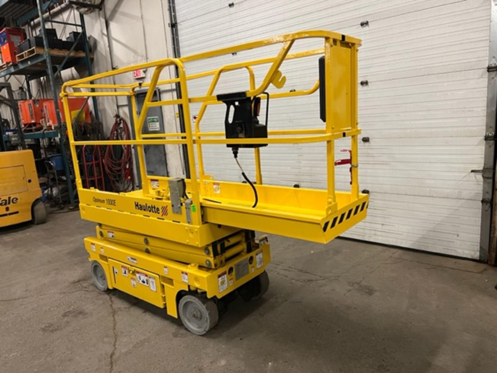 2015 Haulotte 1930E Electric Scissor Lift 500lbs Capacity with 19' platform height 24V unit with