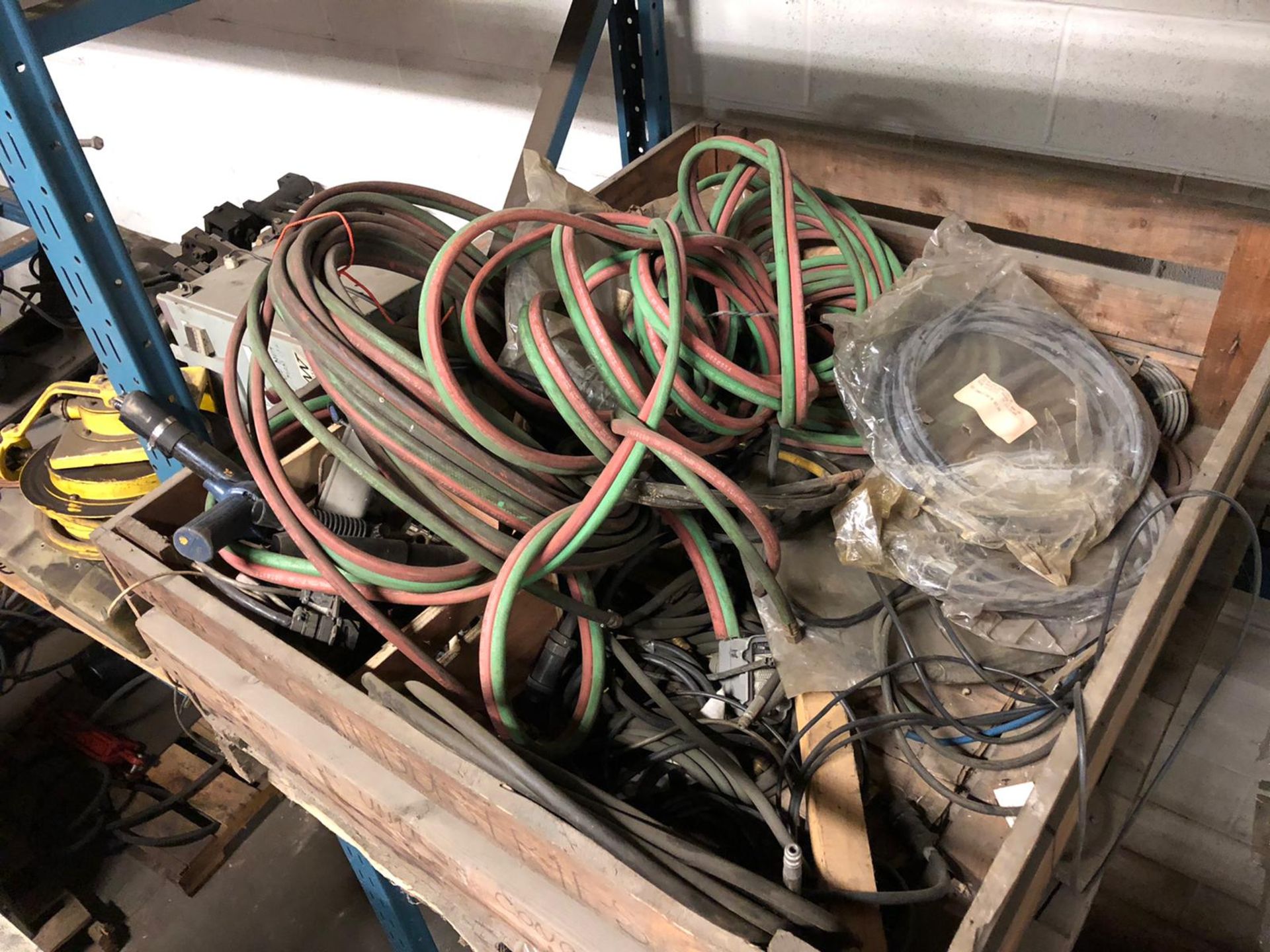 Lot of welding cables and hoses with electrical wire