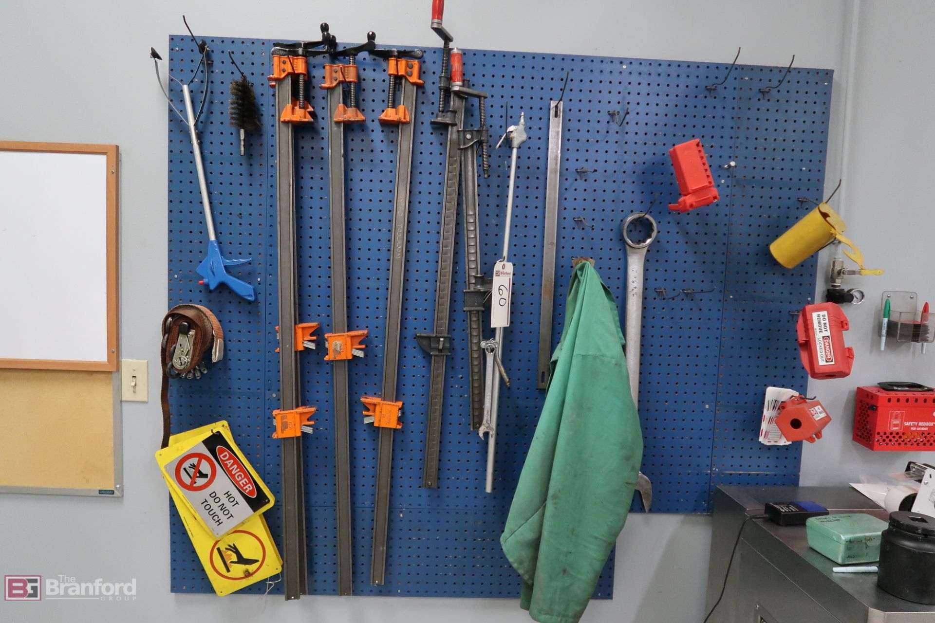 Assorted Clamps Vices Tools on Wall