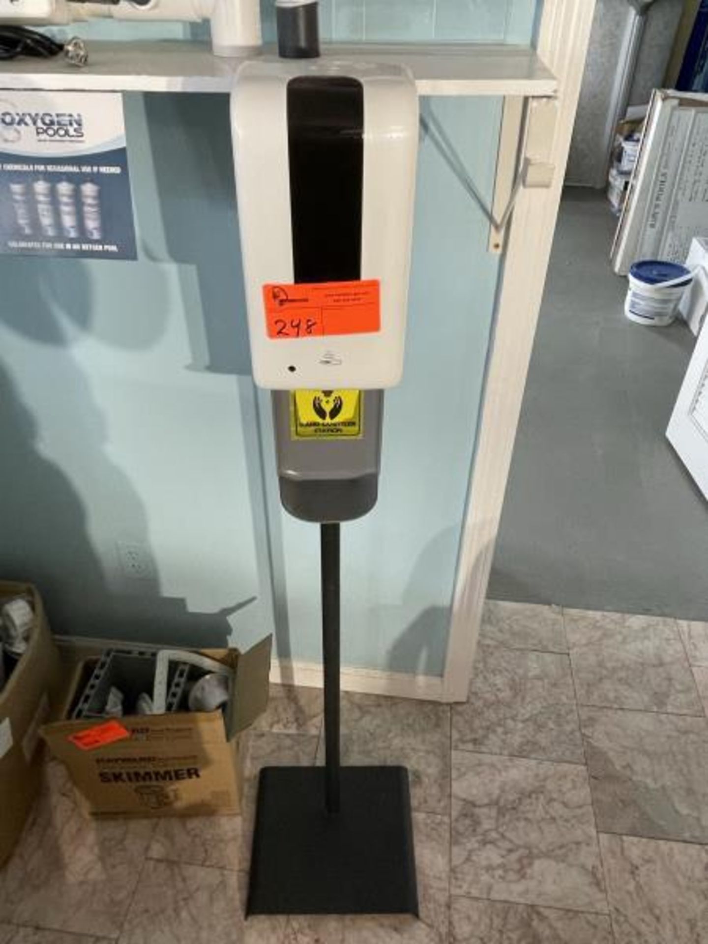 Hand sanitizer pole mounted