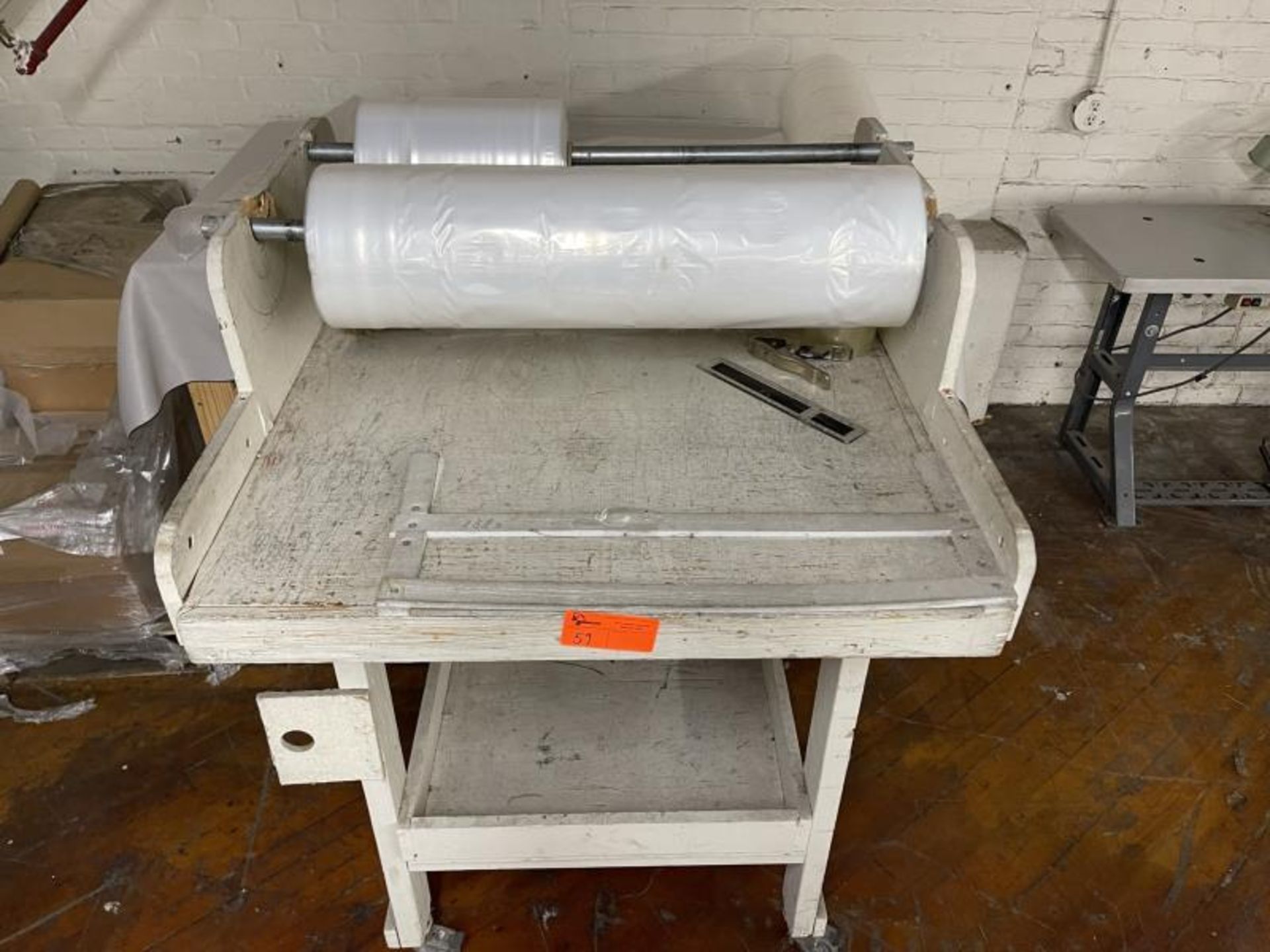 Bagging Station with Pallet of Clear Poly Tubing & (2) Rolls of Plastic