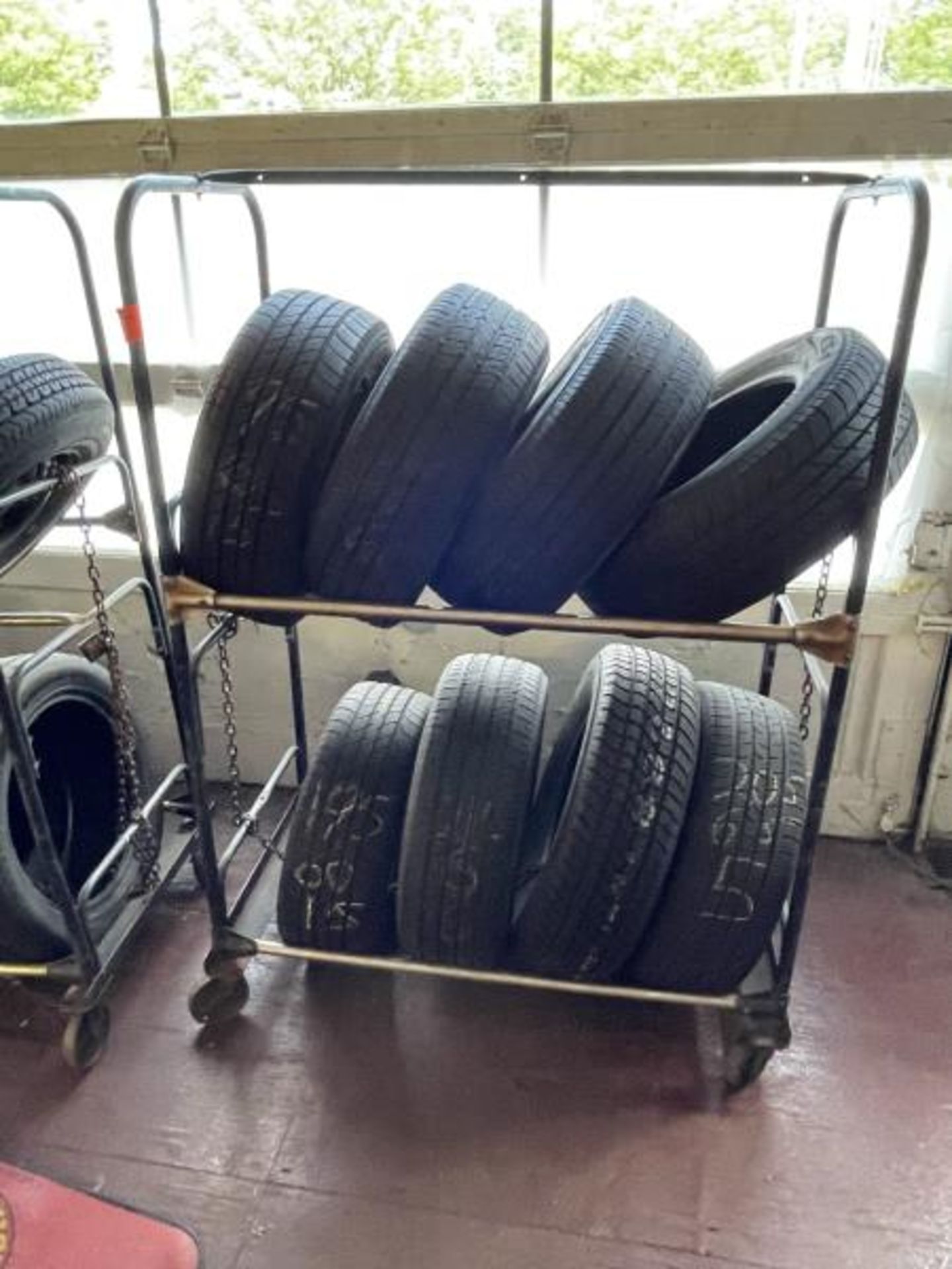 Rolling 2-Tier Tire Rack with Assorted Tires