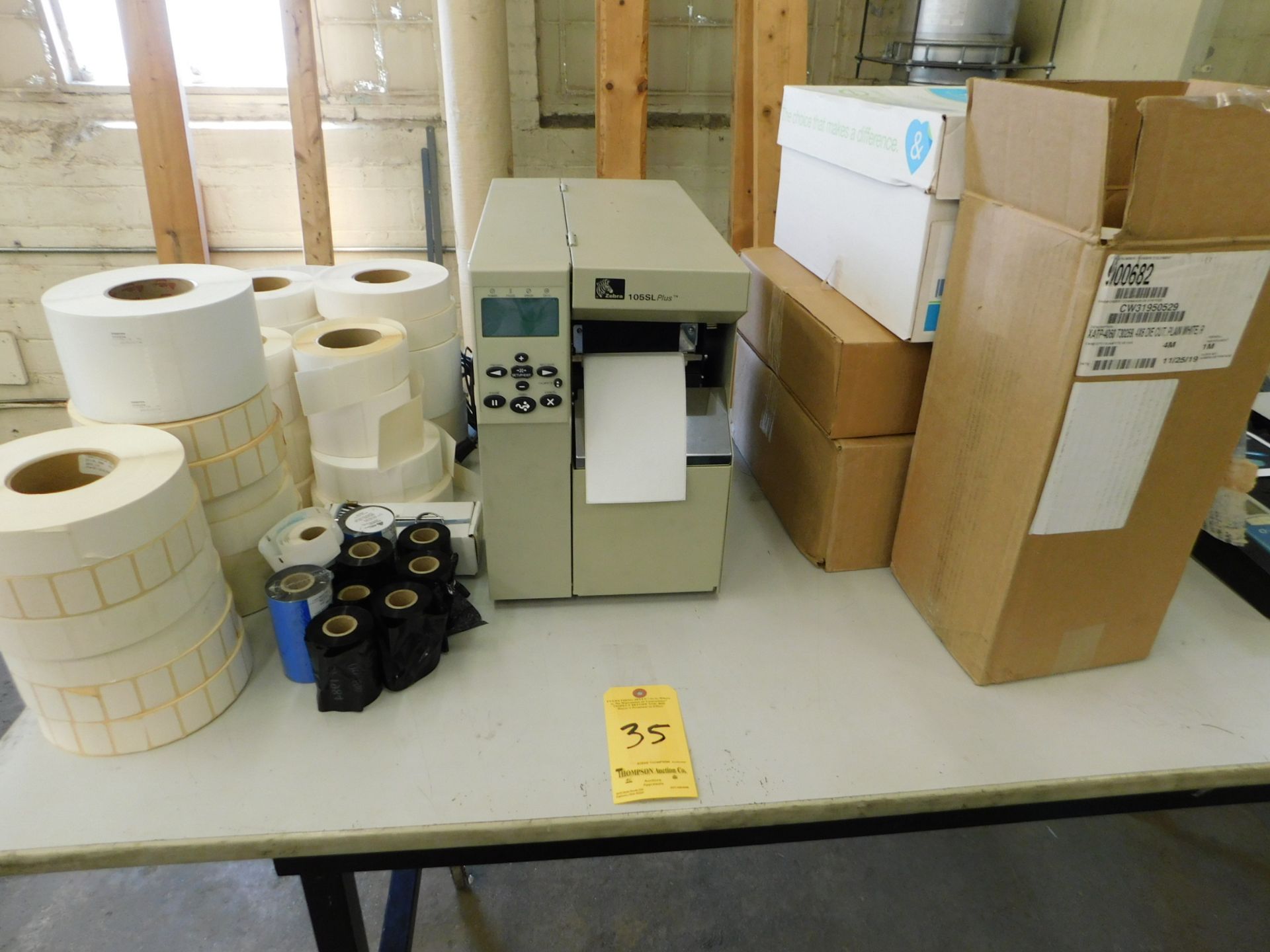 Zebra Label Printer, Model 105SL-Plus, with Boxes of label Inventory and 7' Adjustable Table