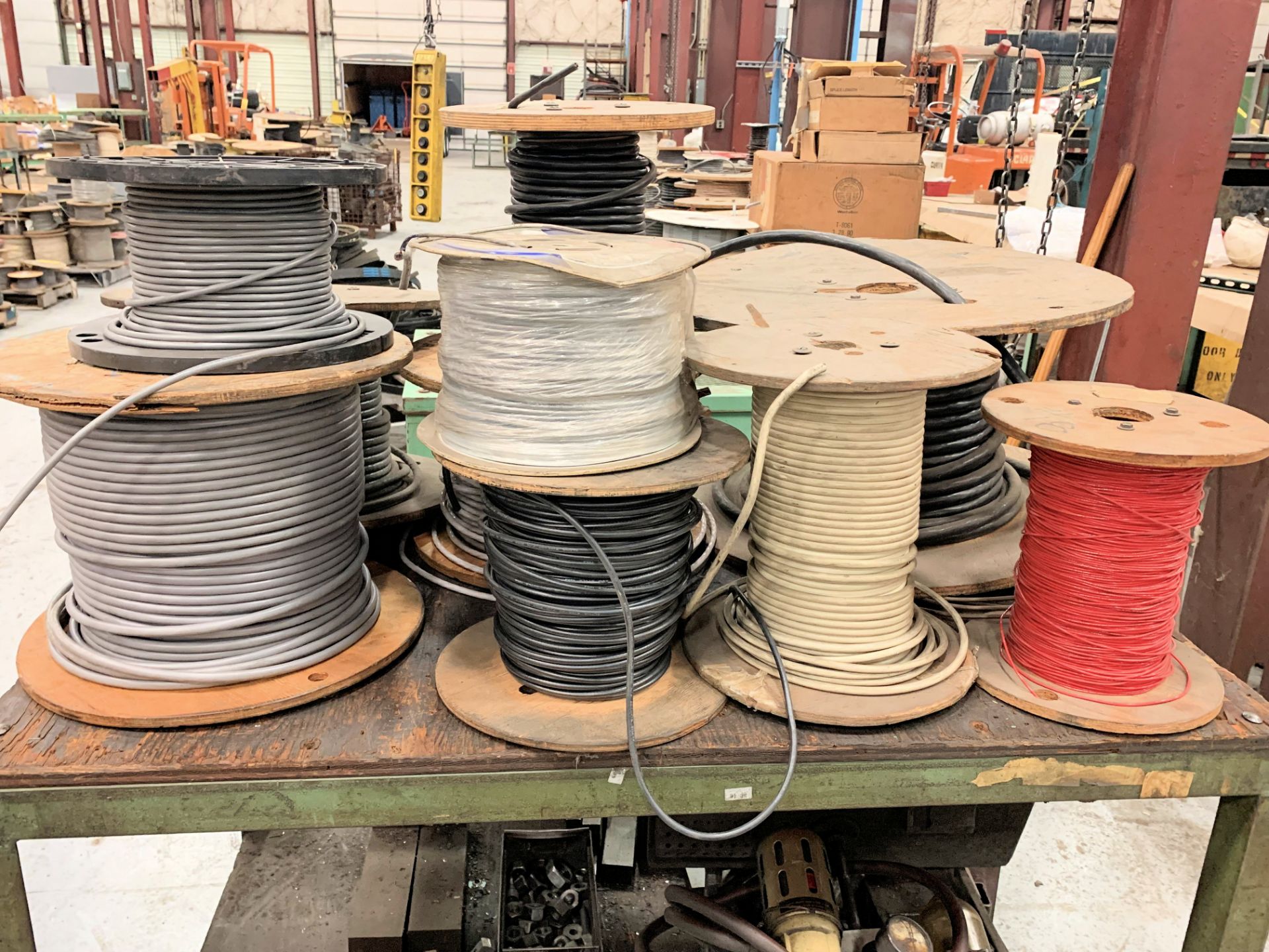 Lot-Various Spools of Electrical Wire on Top of (1) Bench