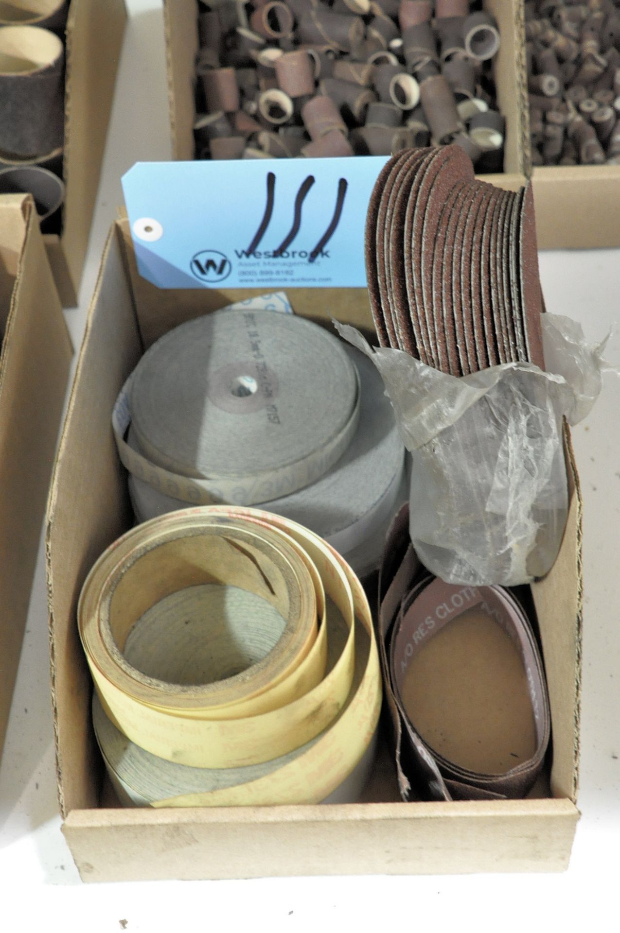 Lot-Sanding Disks and Roll Material in (1) Box Under (1) Table