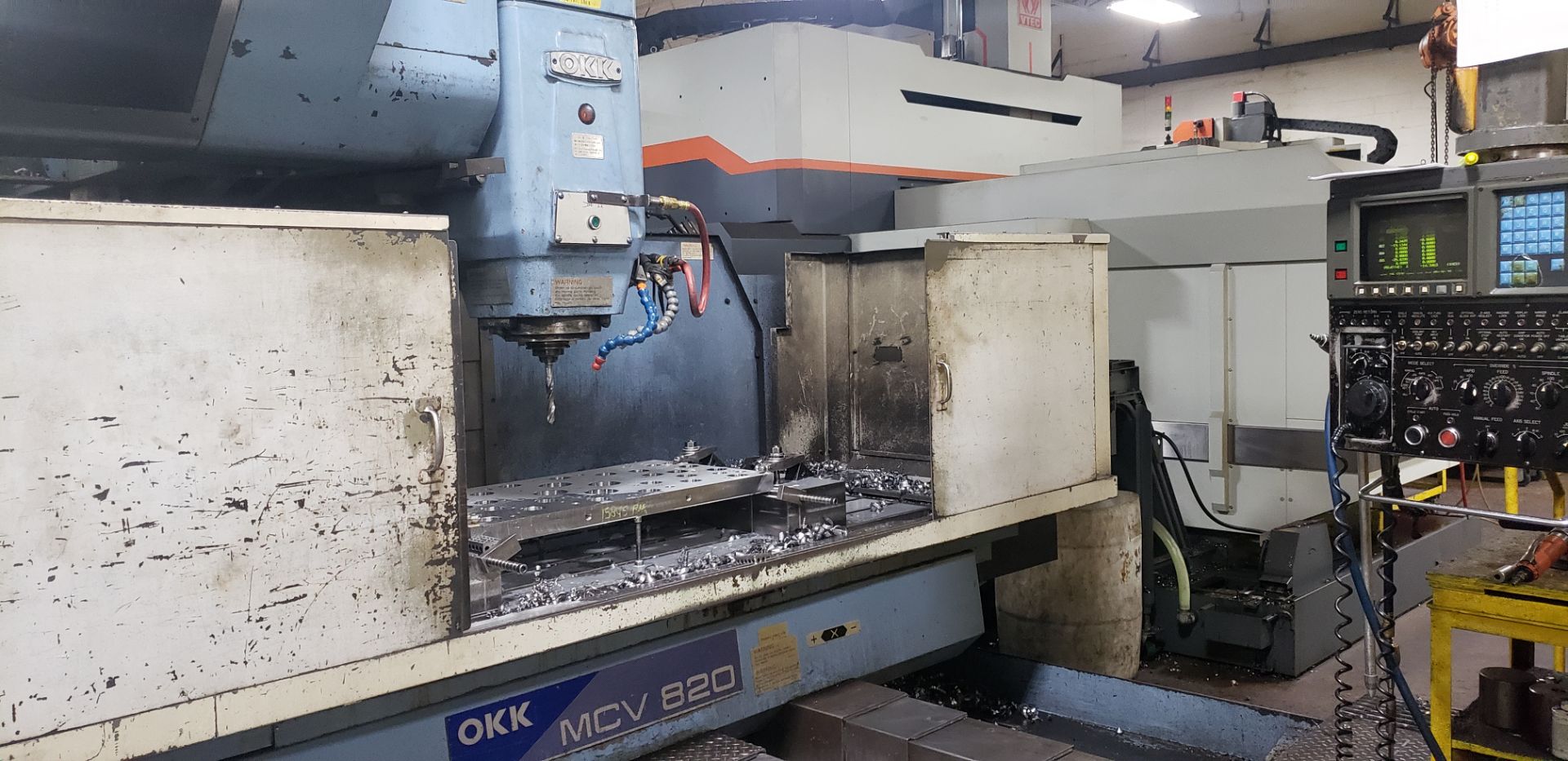 OKK MCV-820 CNC Vertical Machining Center, X-62.75” Y-32.25” Z-28.25”, 30 ATC, Cat 50, Fanuc 15-M