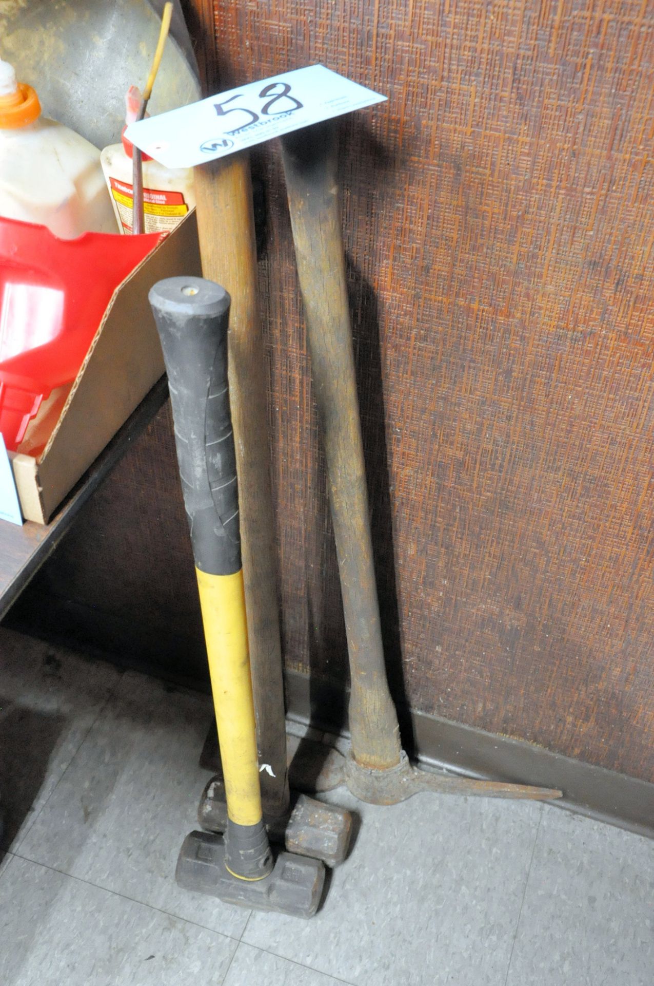 Lot-(2) Sledge Hammers and (1) Pick on Floor