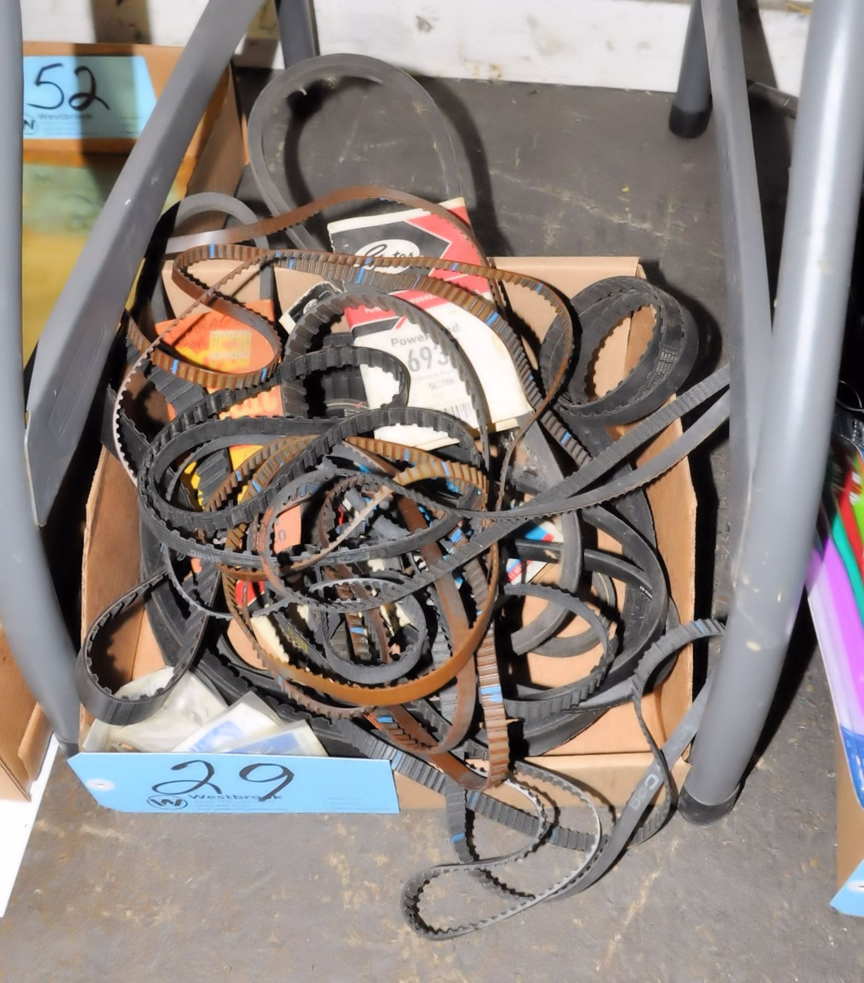 Lot-Various Drive Belts in (1) Box on Floor Under (1) Table