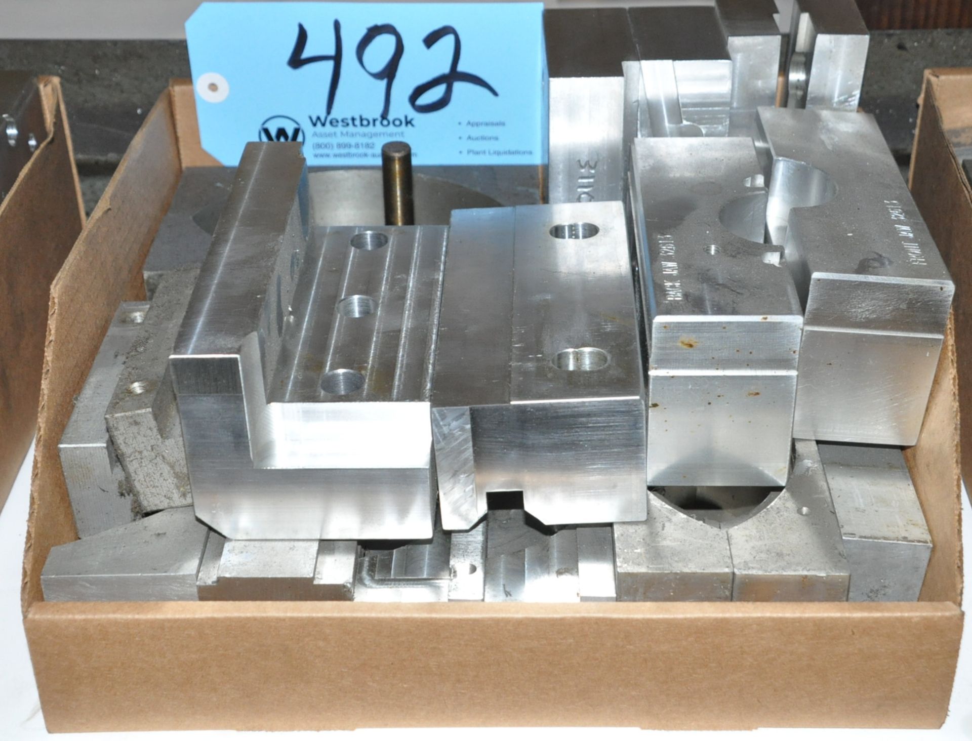 Lot-Various Machine Vise Jaws in (1) Box Under (1) Bench