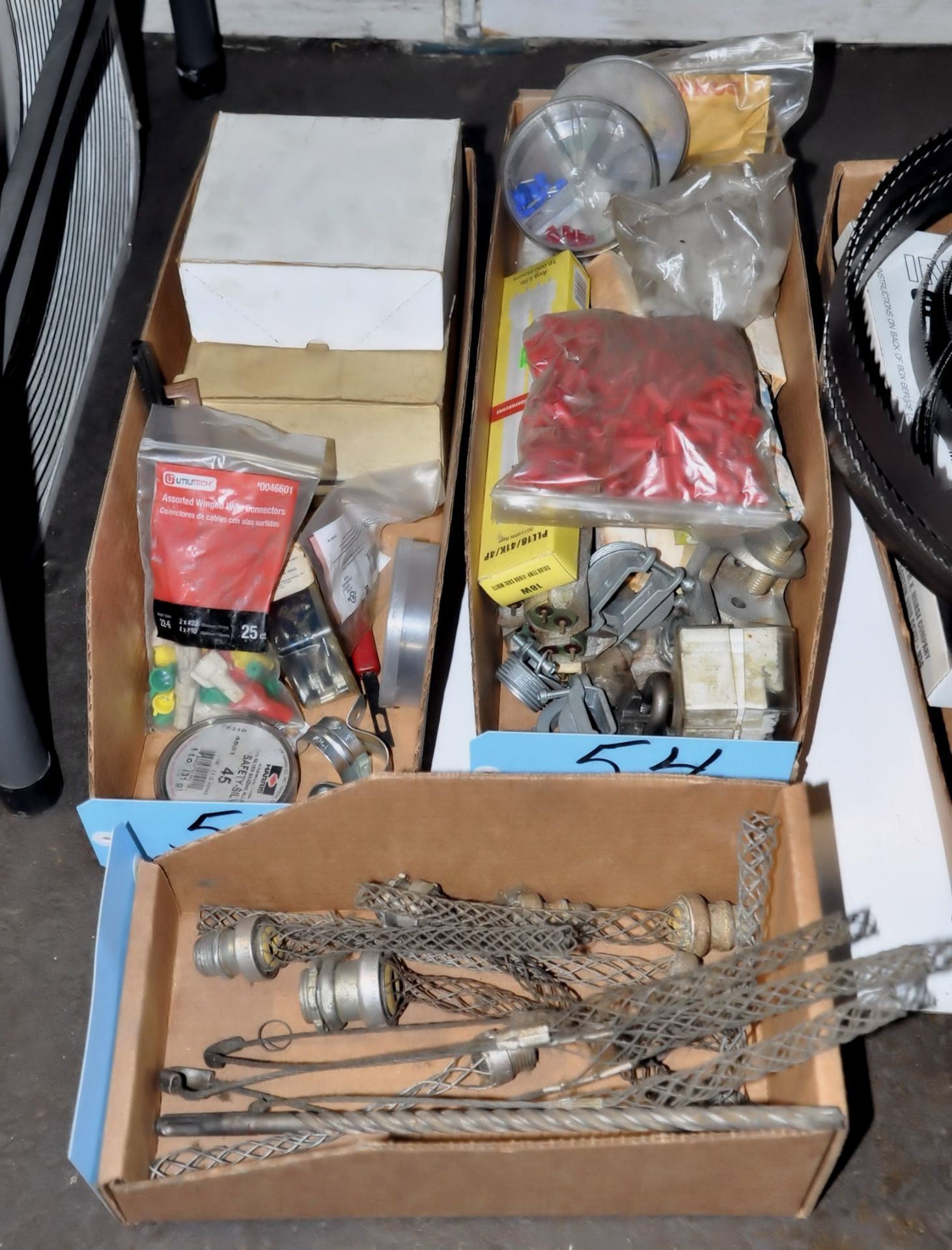 Lot-Various Electrical Hardware in (3) Boxes on Floor Under (1) Table