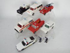 Dinky Toys - An unboxed squad of late issue Dinky Toys emergency vehicles.