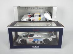 Norev, UT Models - Two boxed diecast 1:18 scale sports cars.